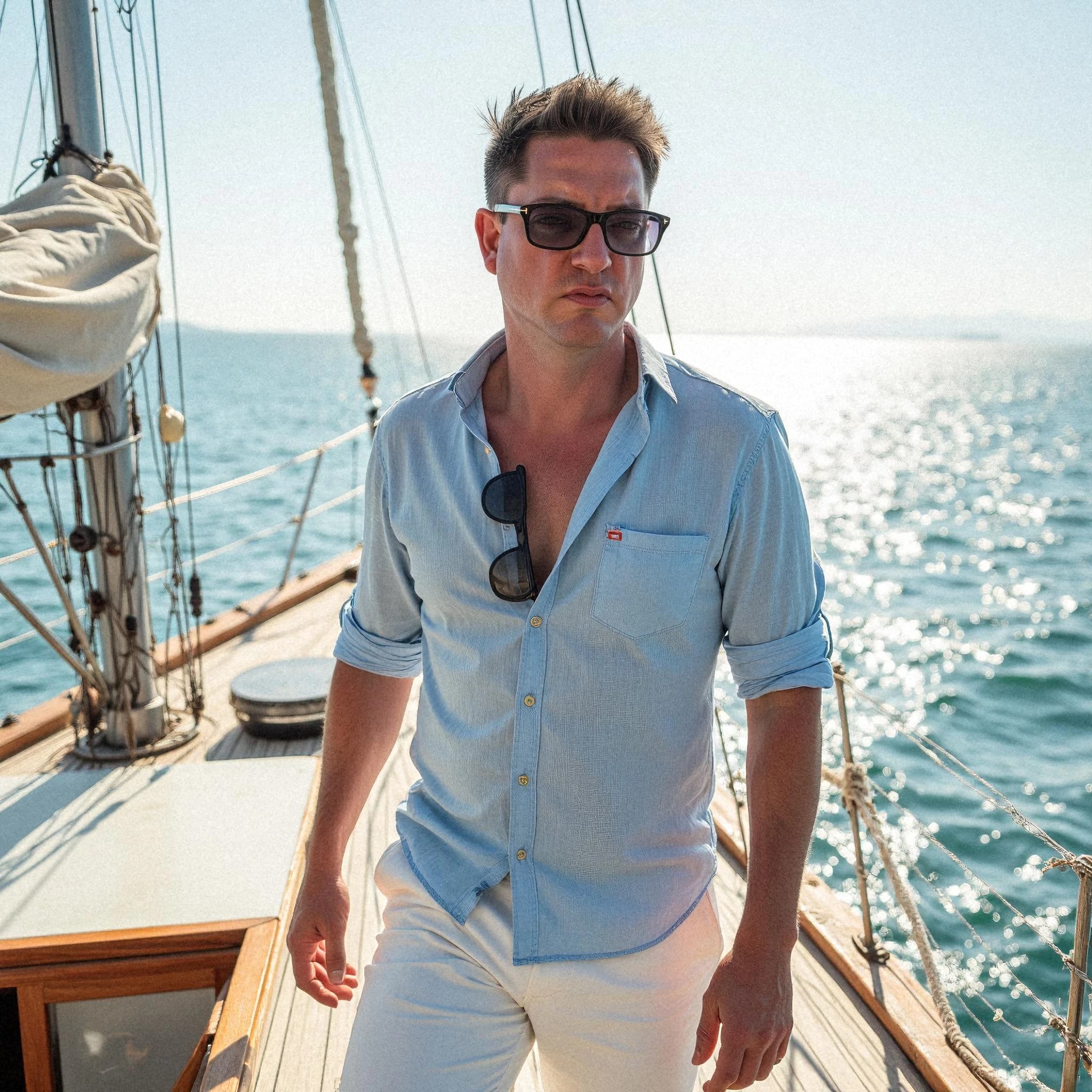 Professional headshot example: Man Boat Blue Shirt Sunglasses 3 — LinkedInHeadshots.ai