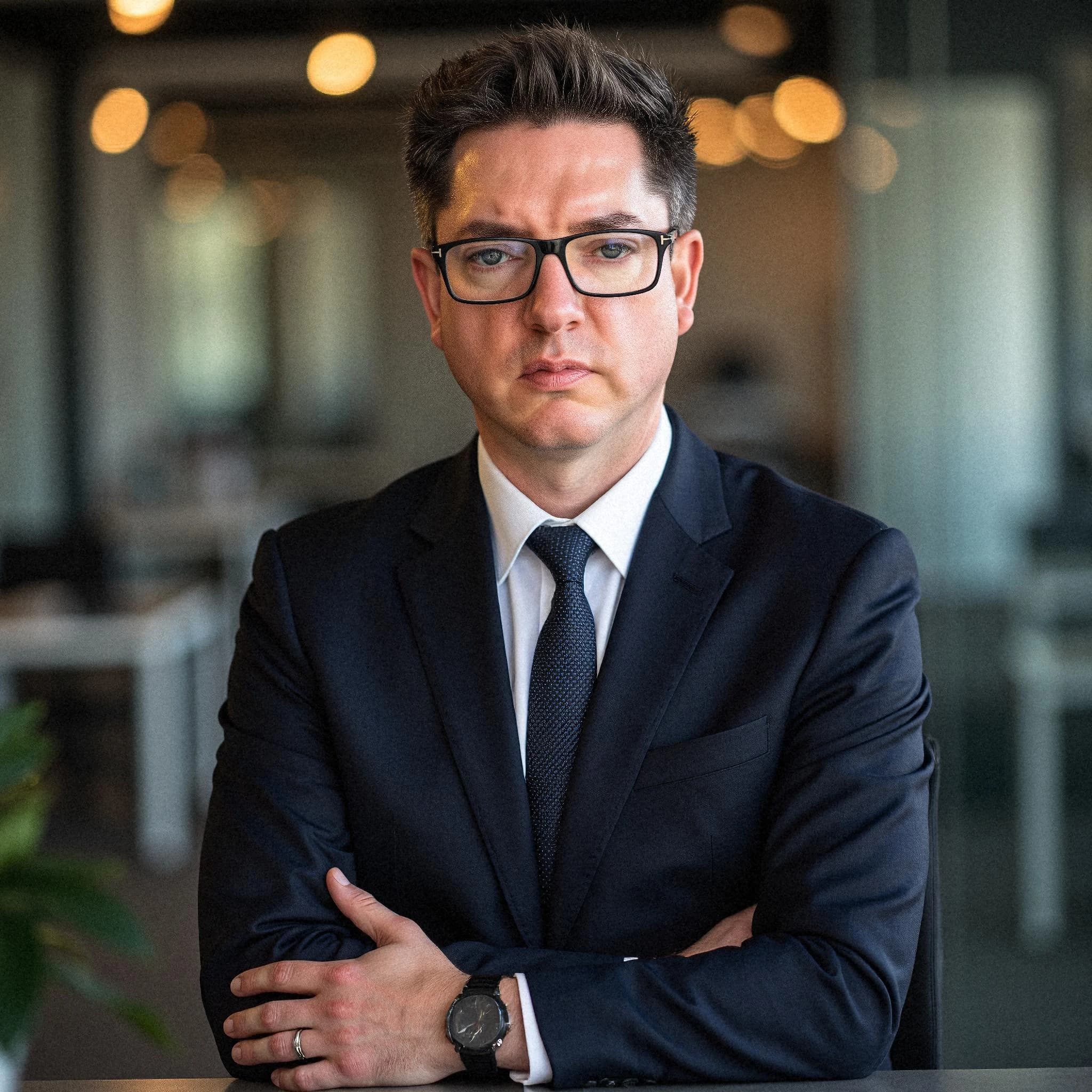 Professional headshot example: Man Office Suit Crossed Arms 5 — LinkedInHeadshots.ai