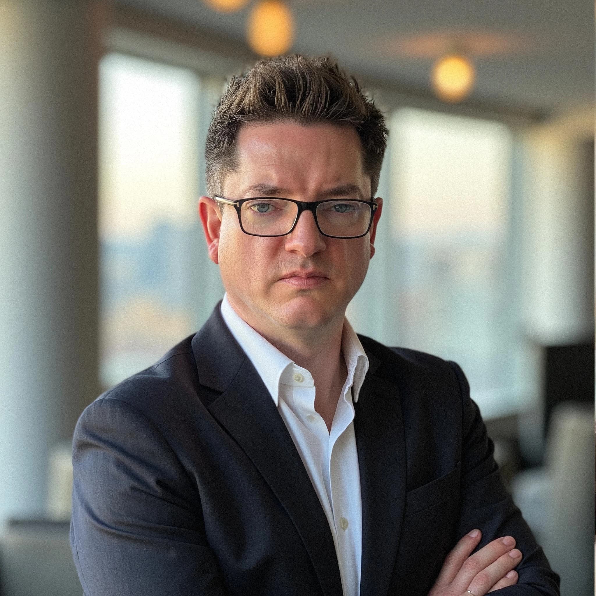 Professional headshot example: Man Office Suit Crossed Arms 7 — LinkedInHeadshots.ai