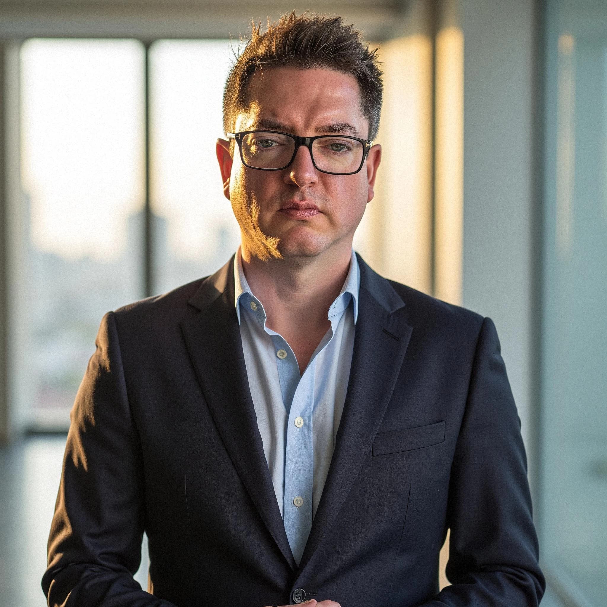 Professional headshot example: Man Office Suit Standing 4 — LinkedInHeadshots.ai