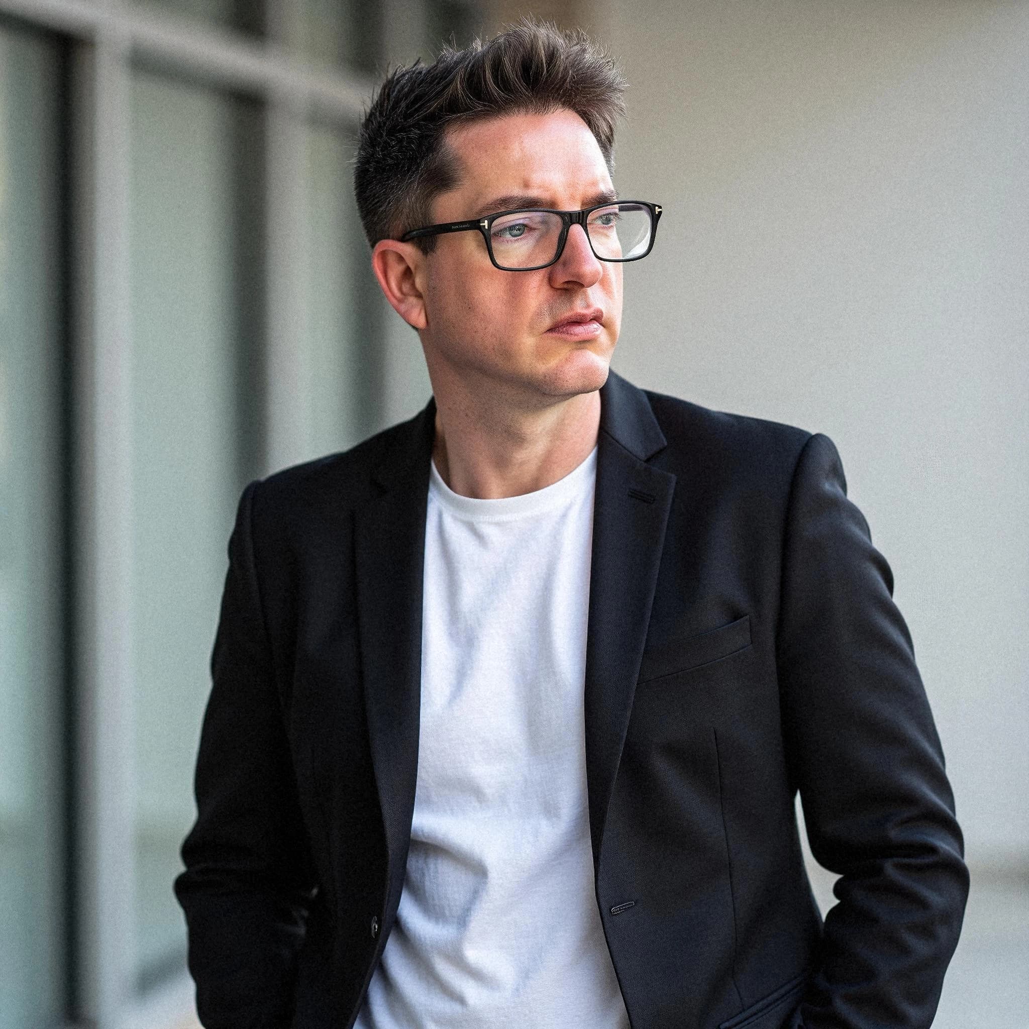 Professional headshot example: Man Outdoors Black Jacket Standing — LinkedInHeadshots.ai