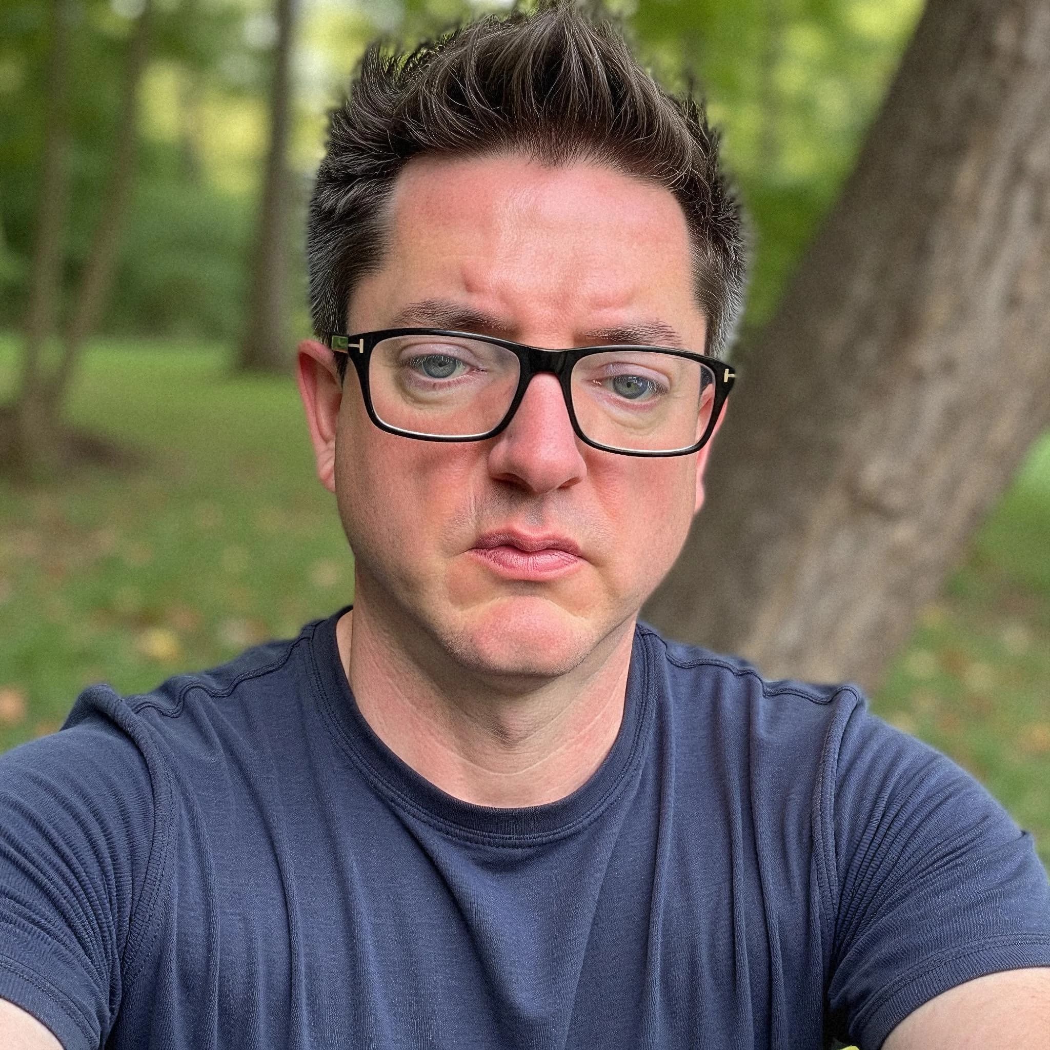 Professional headshot example: Man Outdoors Blue Shirt Selfie — LinkedInHeadshots.ai