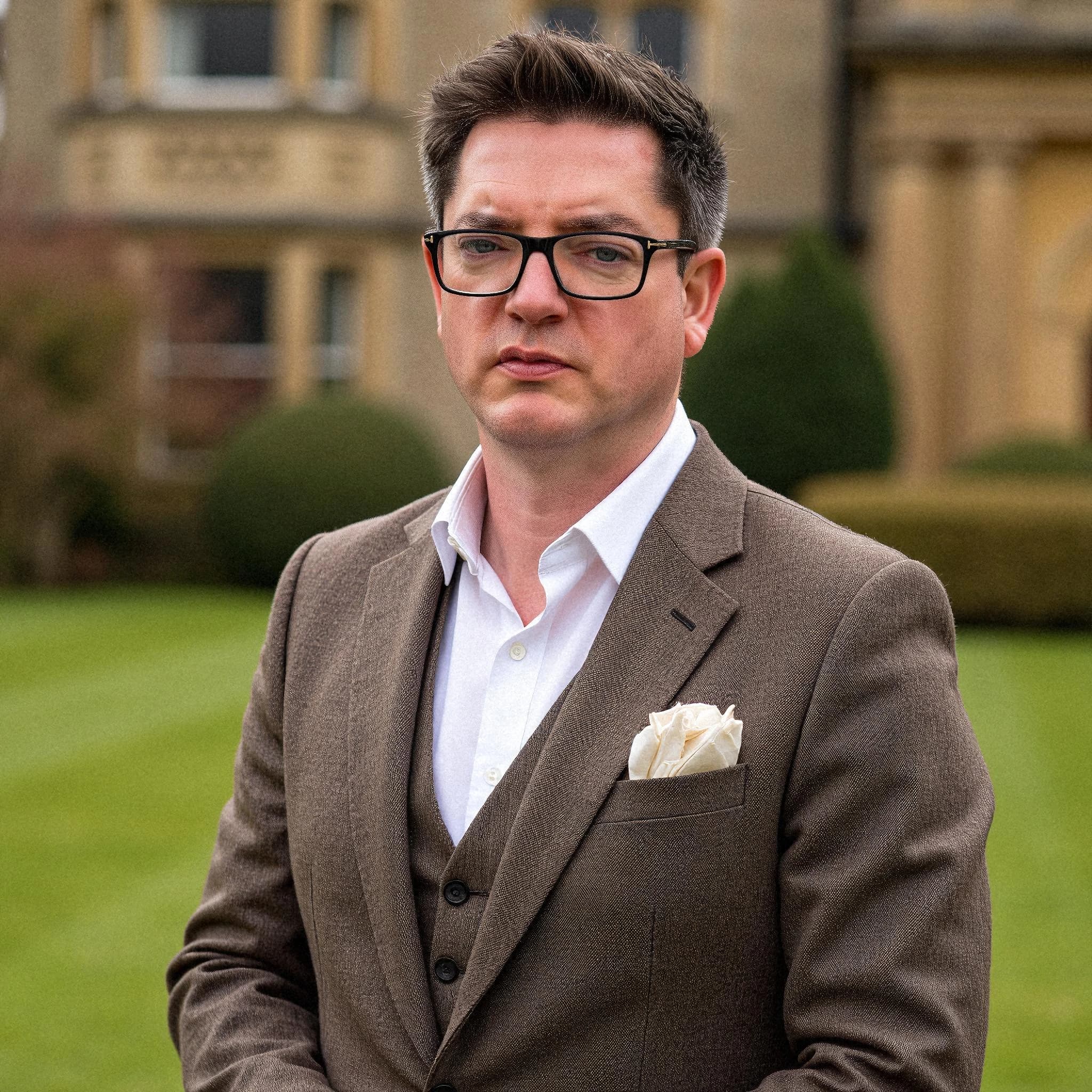 Professional headshot example: Man Outdoors Brown Suit Standing 4 — LinkedInHeadshots.ai