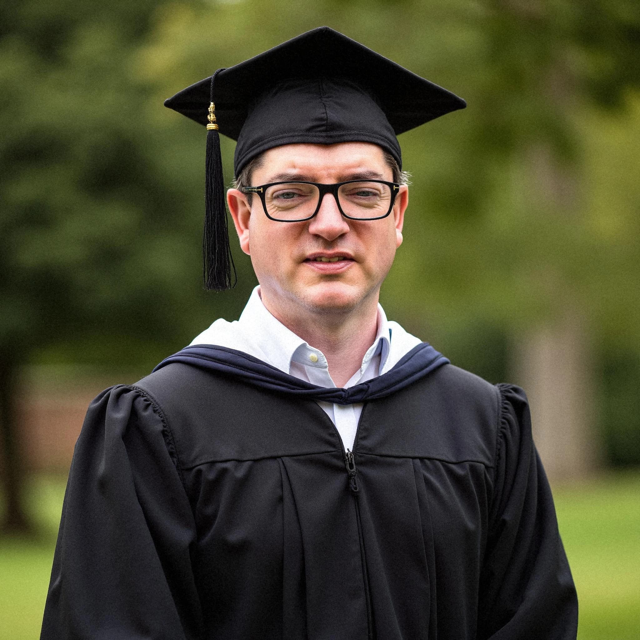 Professional headshot example: Man Outdoors Graduation Gown Smiling 3 — LinkedInHeadshots.ai
