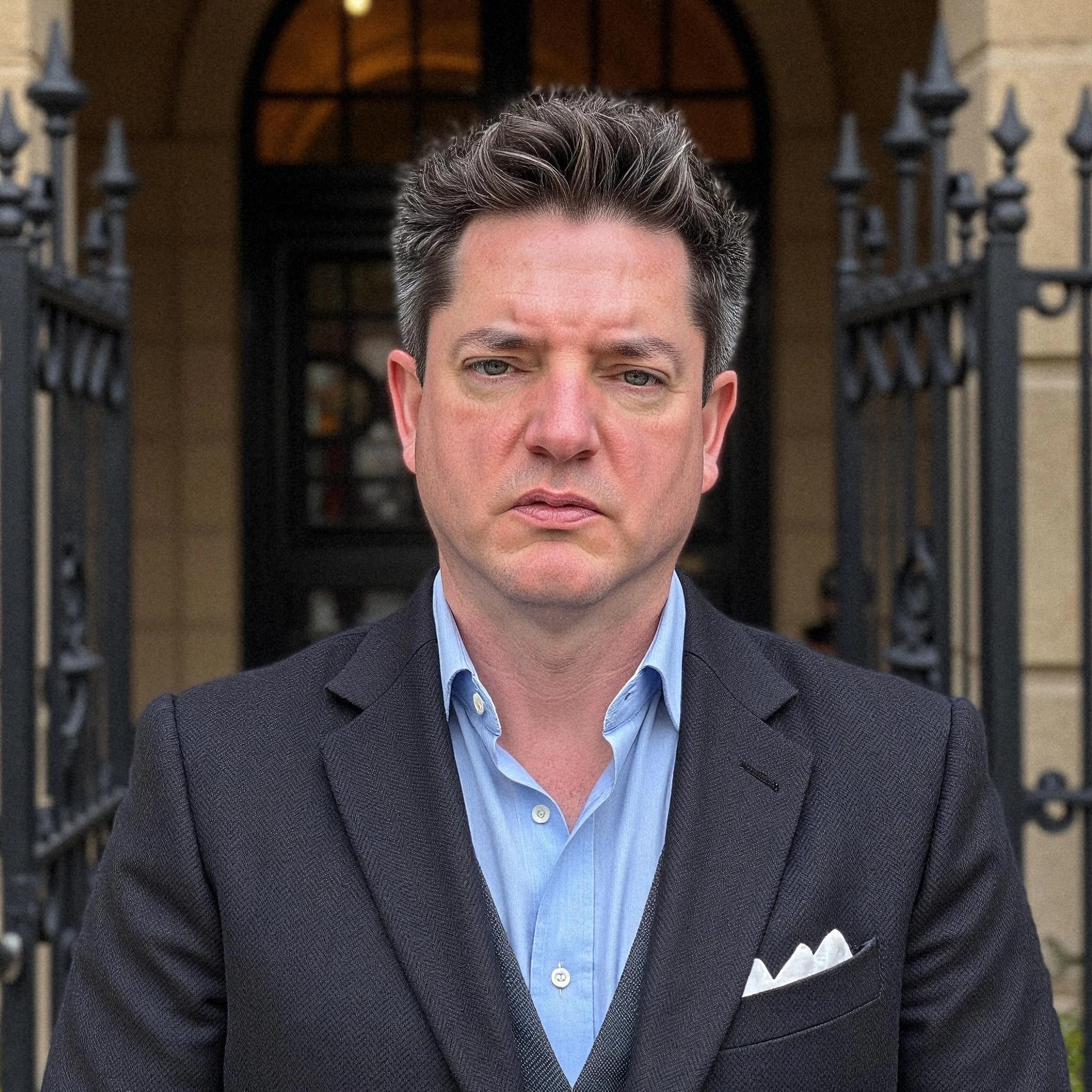 Professional headshot example: Man Outdoors Suit Serious Expression — LinkedInHeadshots.ai