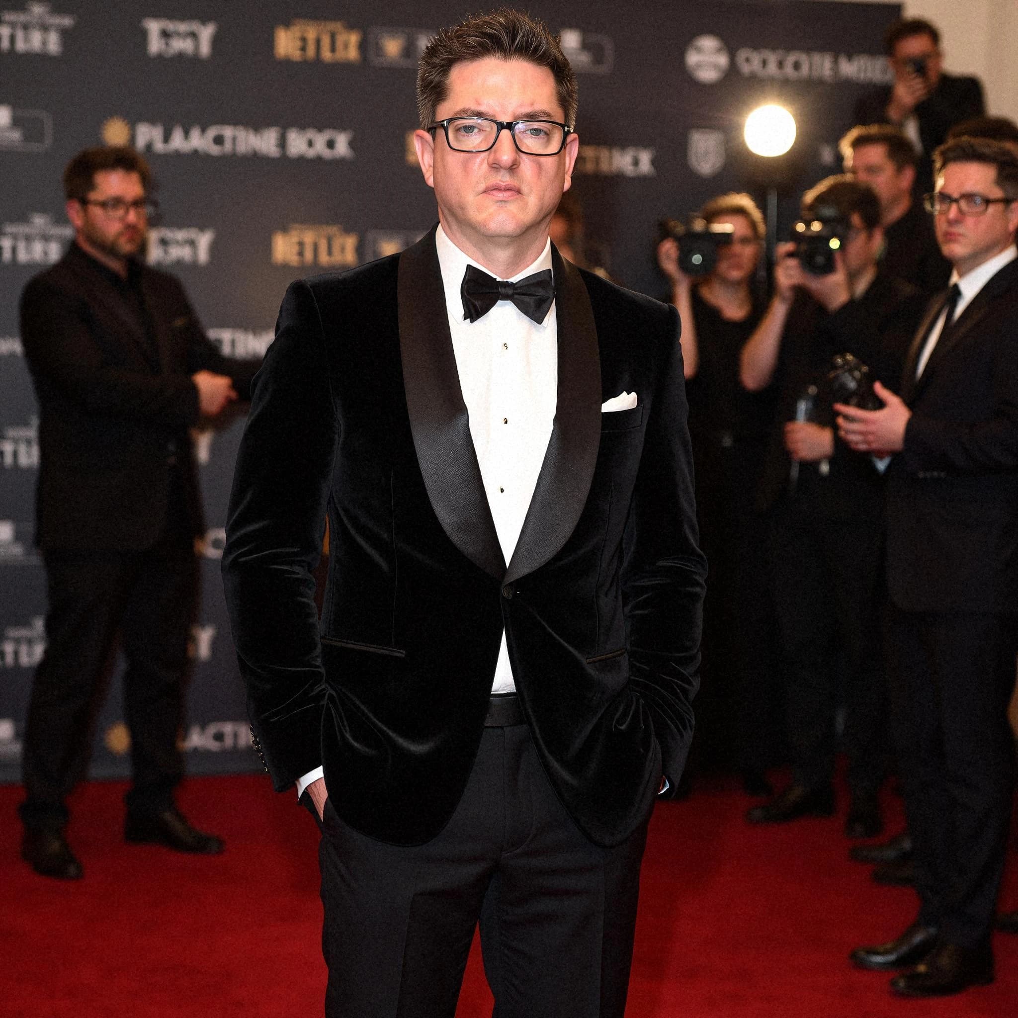 Professional headshot example: Man Red Carpet Black Tuxedo Standing 5 — LinkedInHeadshots.ai