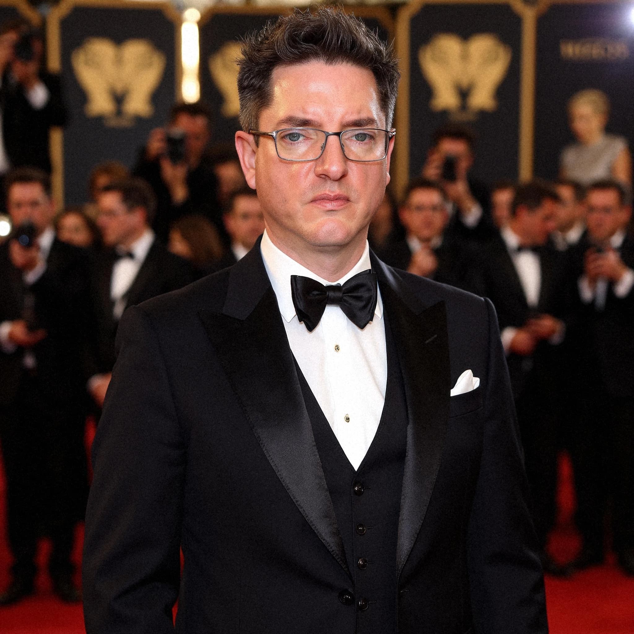 Professional headshot example: Man Red Carpet Black Tuxedo Standing 6 — LinkedInHeadshots.ai