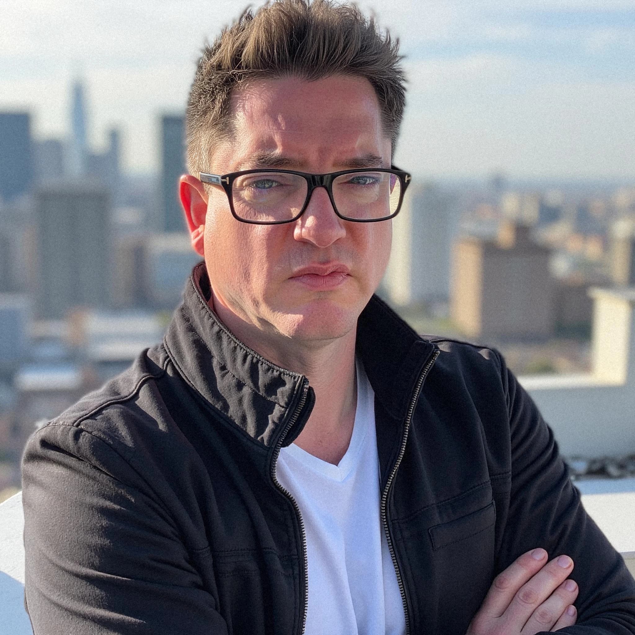 Professional headshot example: Man Rooftop Black Jacket Crossed Arms — LinkedInHeadshots.ai