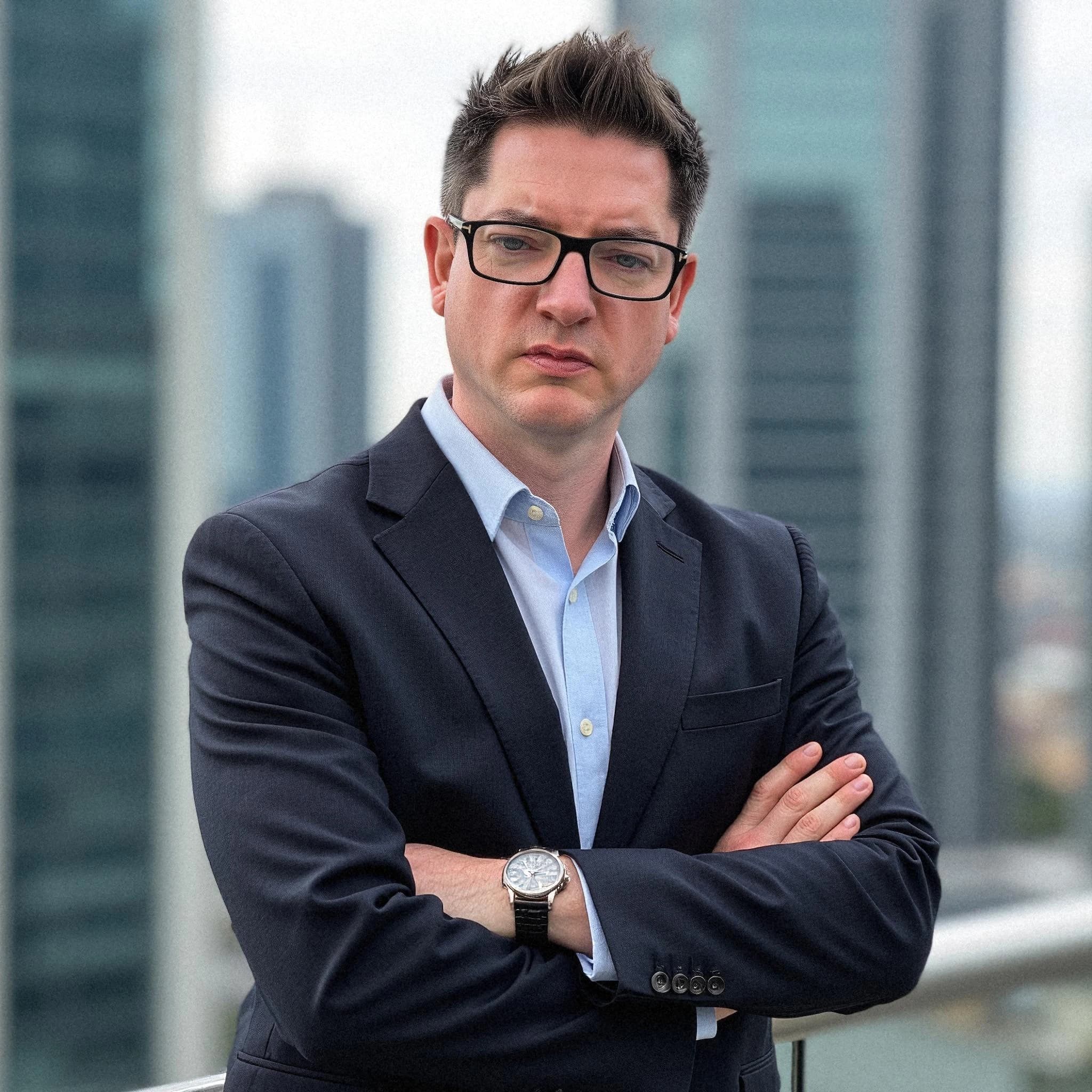 Professional headshot example: Man Rooftop Suit Arms Crossed 3 — LinkedInHeadshots.ai