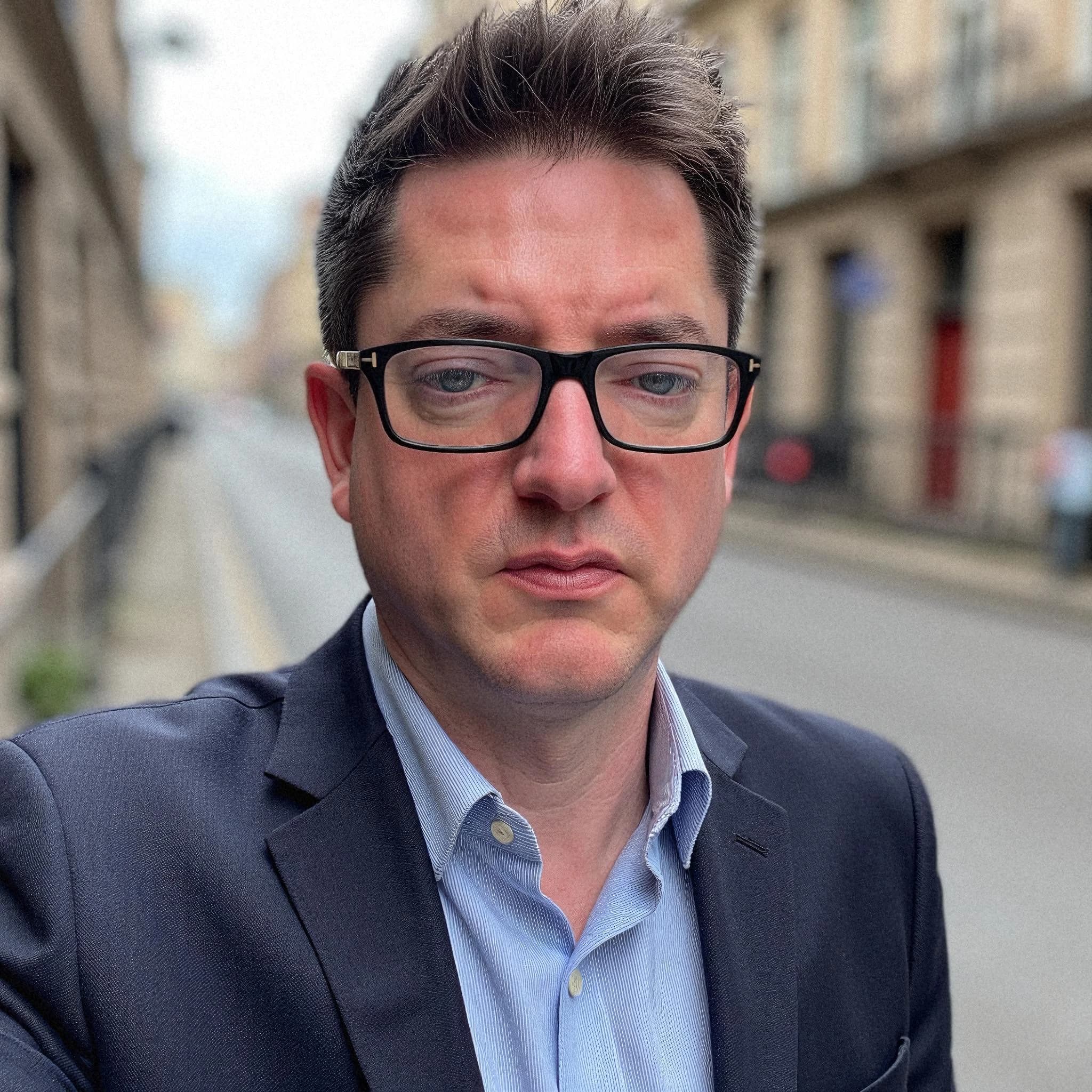 Professional headshot example: Man Street Suit Selfie — LinkedInHeadshots.ai