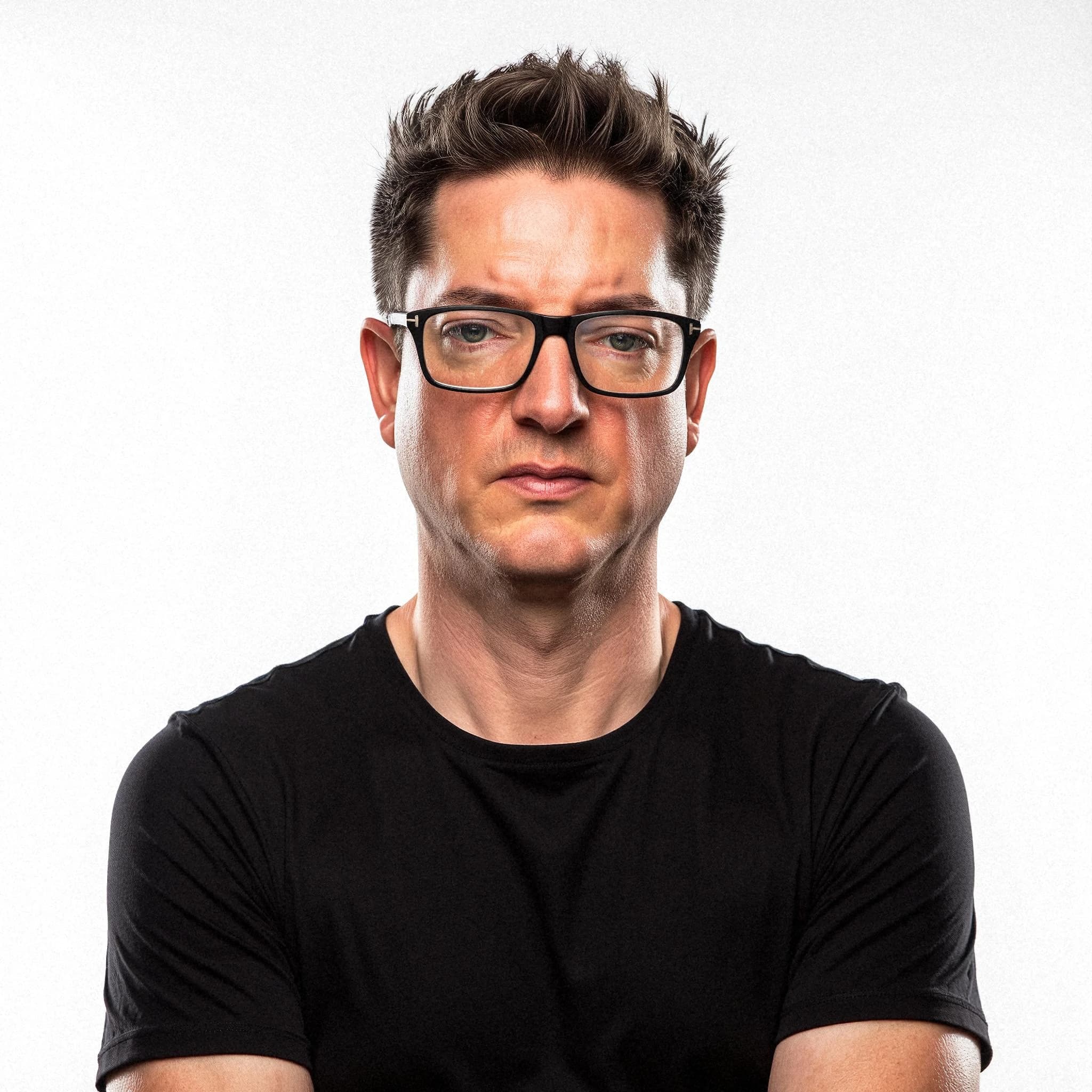 Professional headshot example: Man Studio Black Shirt Glasses — LinkedInHeadshots.ai