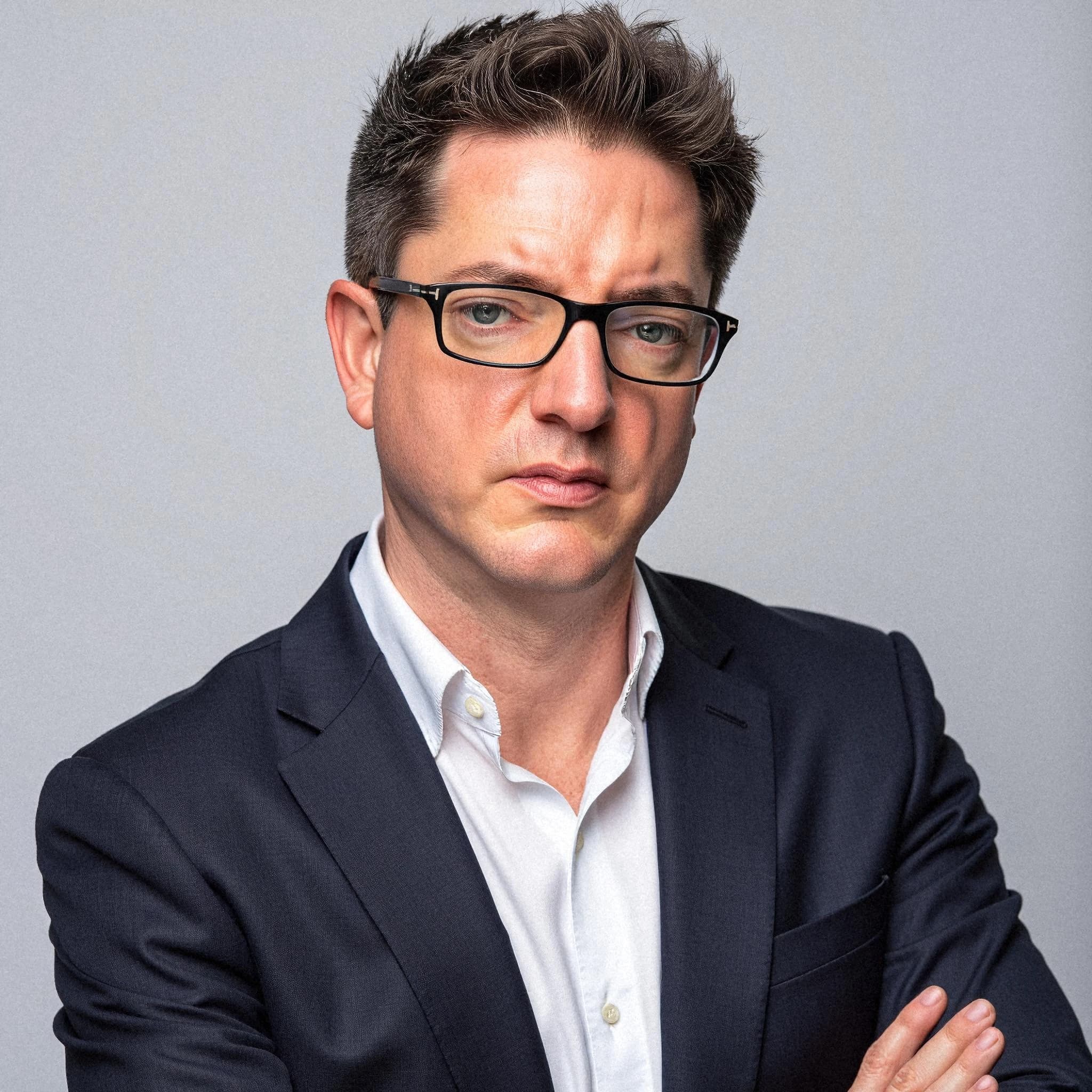 Professional headshot example: Man Studio Suit Crossed Arms 14 — LinkedInHeadshots.ai