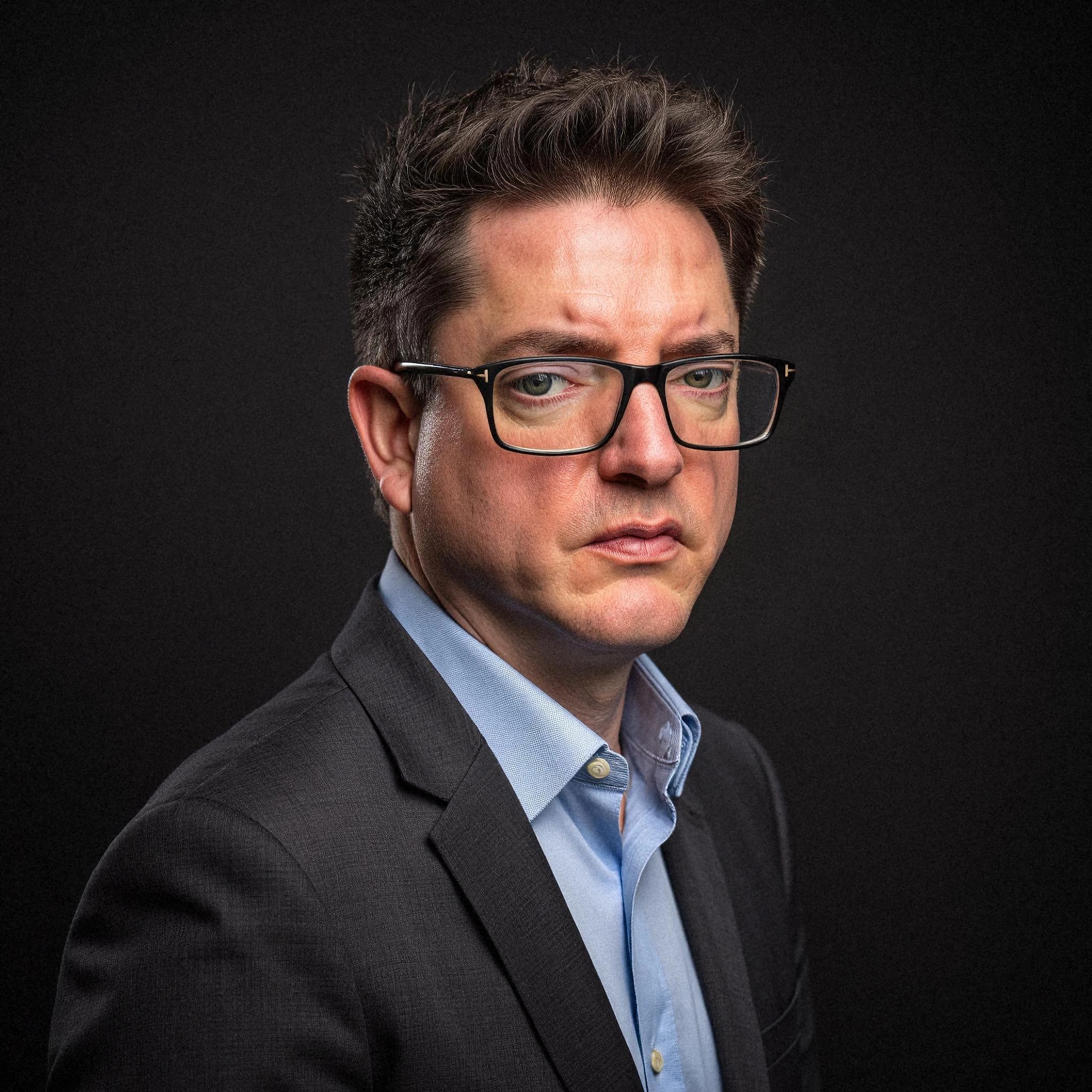Professional headshot example: Man Studio Suit Glasses Portrait 6 — LinkedInHeadshots.ai
