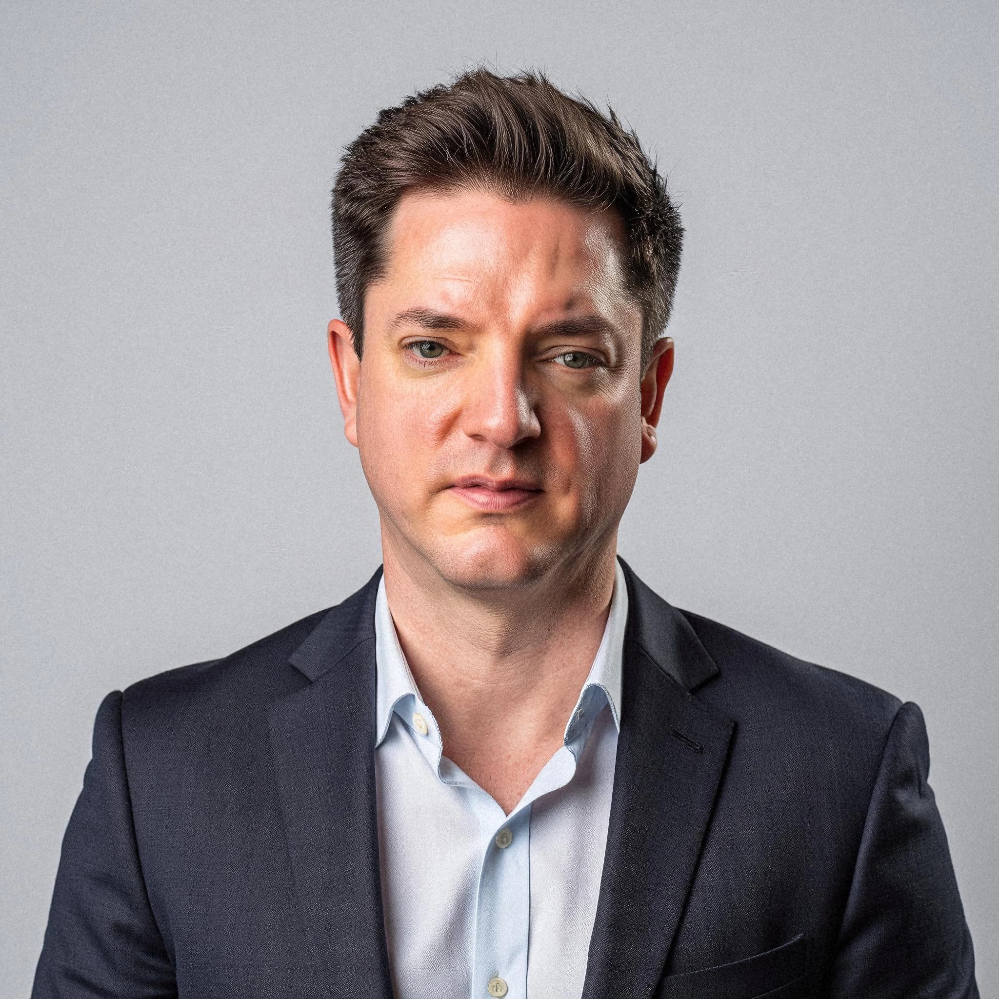 Professional headshot example: Man Studio Suit Neutral Expression — LinkedInHeadshots.ai