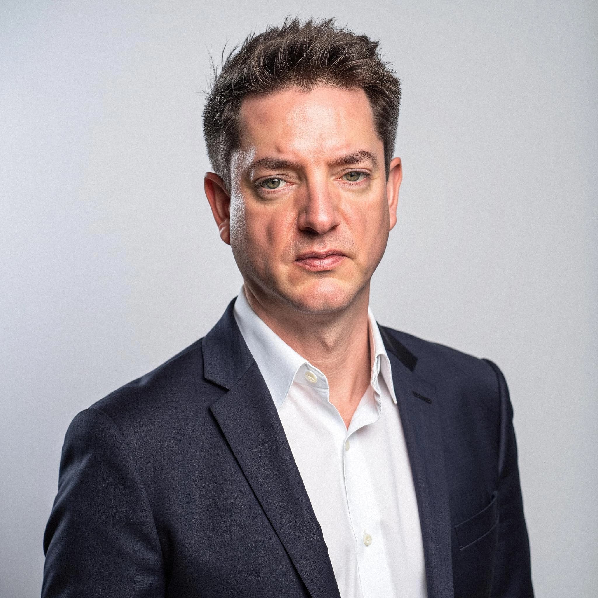 Professional headshot example: Man Studio Suit Serious Expression 2 — LinkedInHeadshots.ai