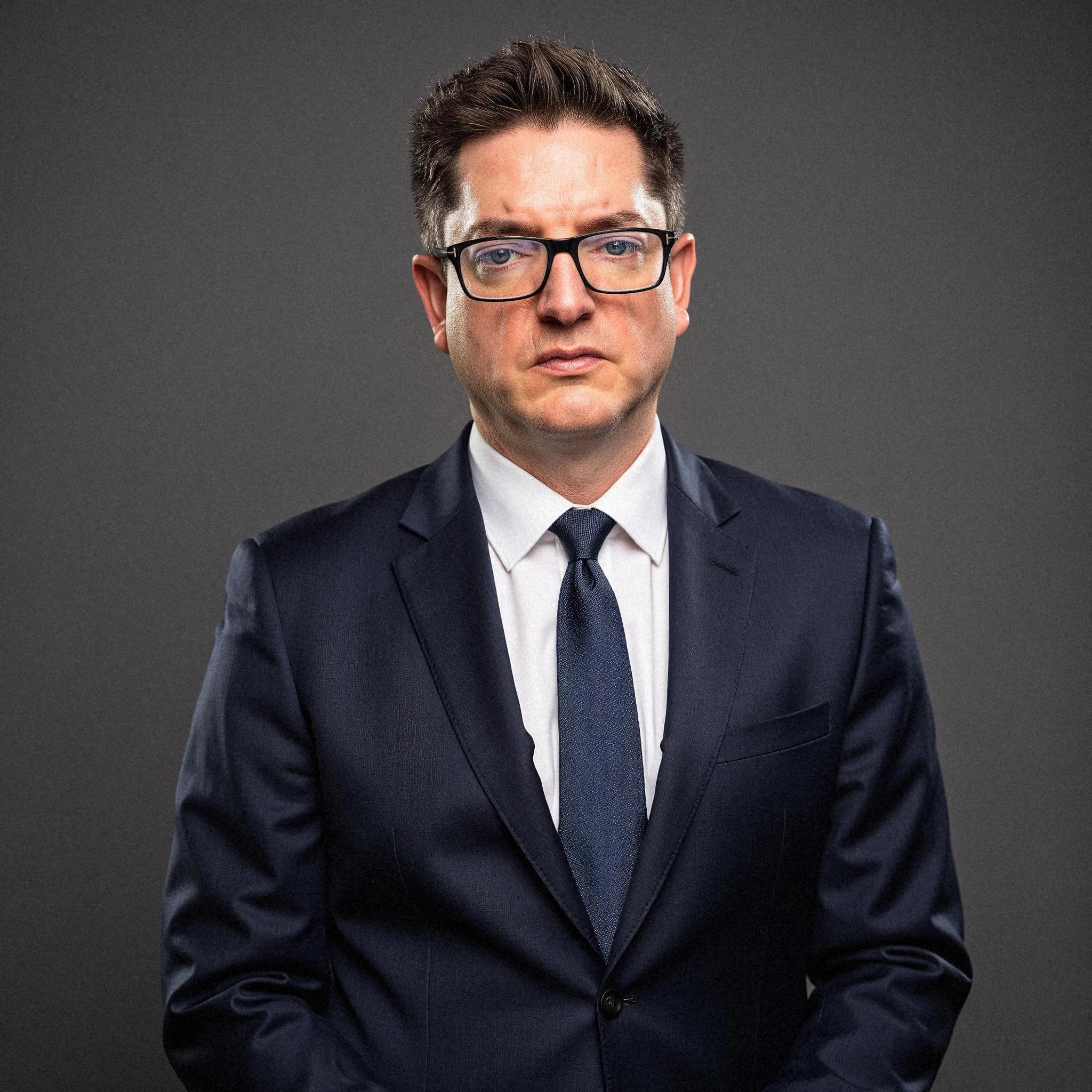 Professional headshot example: Man Studio Suit Standing — LinkedInHeadshots.ai