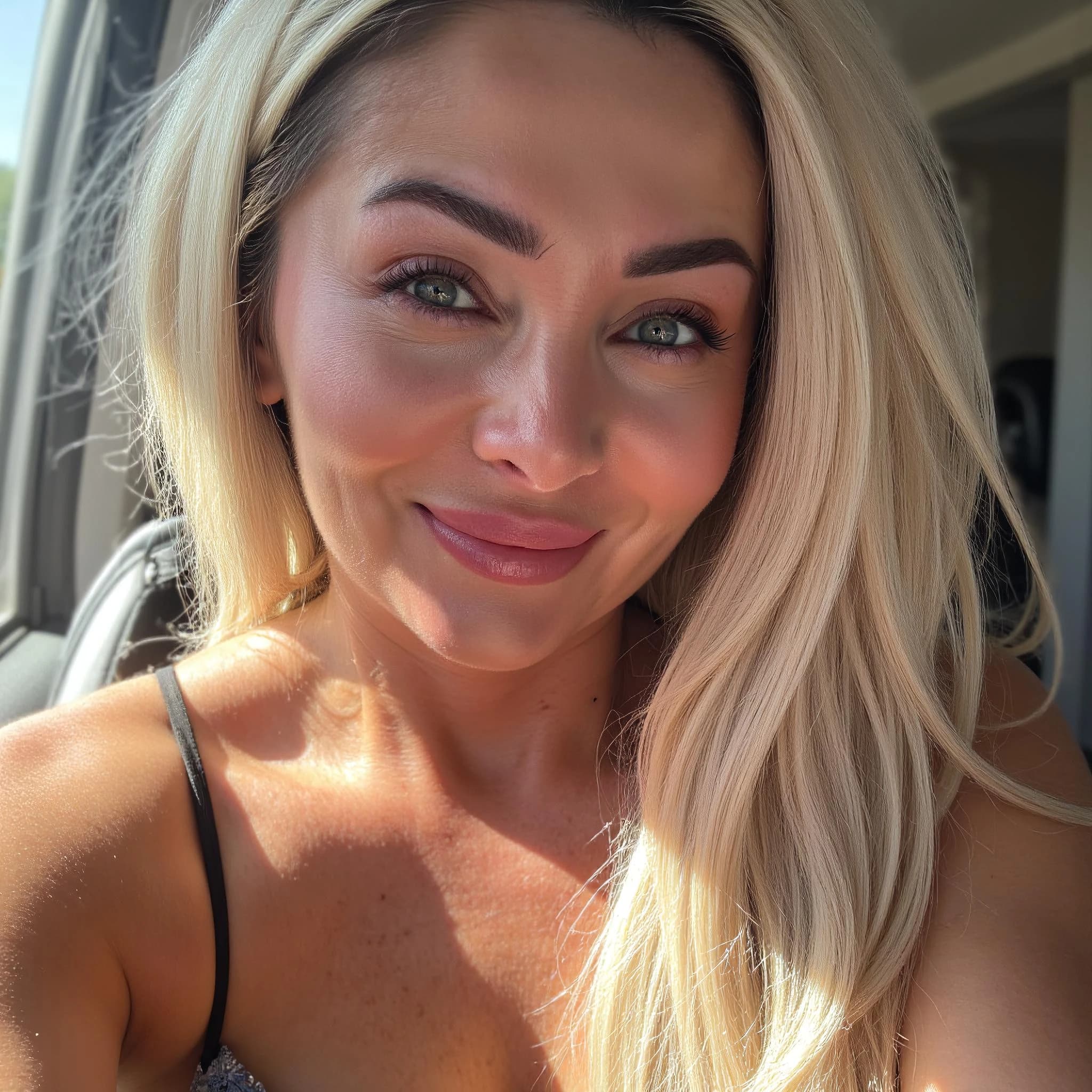 Professional headshot example: Woman Car Blonde Hair Smiling — LinkedInHeadshots.ai