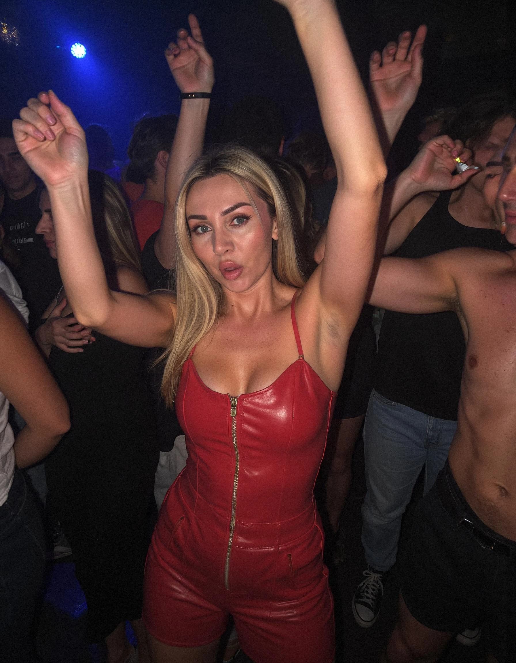 Professional headshot example: Woman Club Red Dress Dancing — LinkedInHeadshots.ai