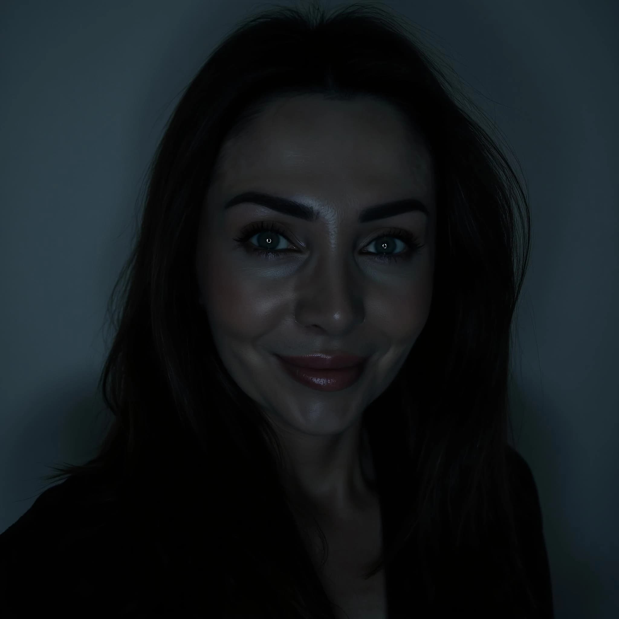 Professional headshot example: Woman Dark Room Black Top Smiling — LinkedInHeadshots.ai