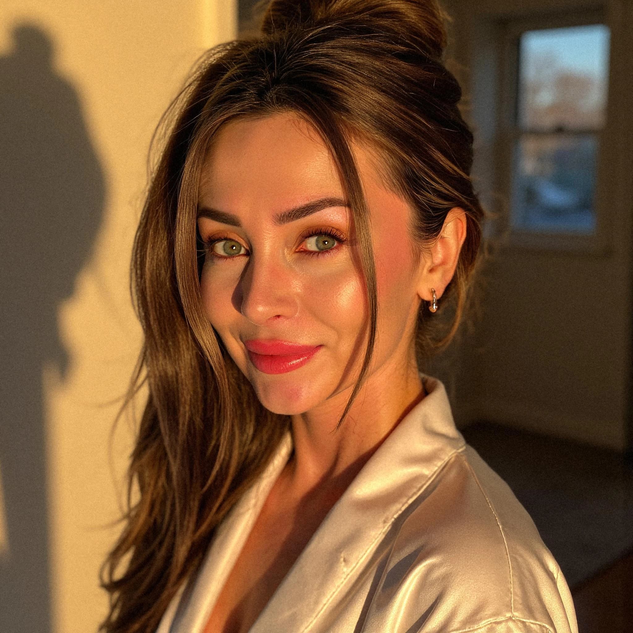 Professional headshot example: Woman Home Satin Robe Smiling 2 — LinkedInHeadshots.ai