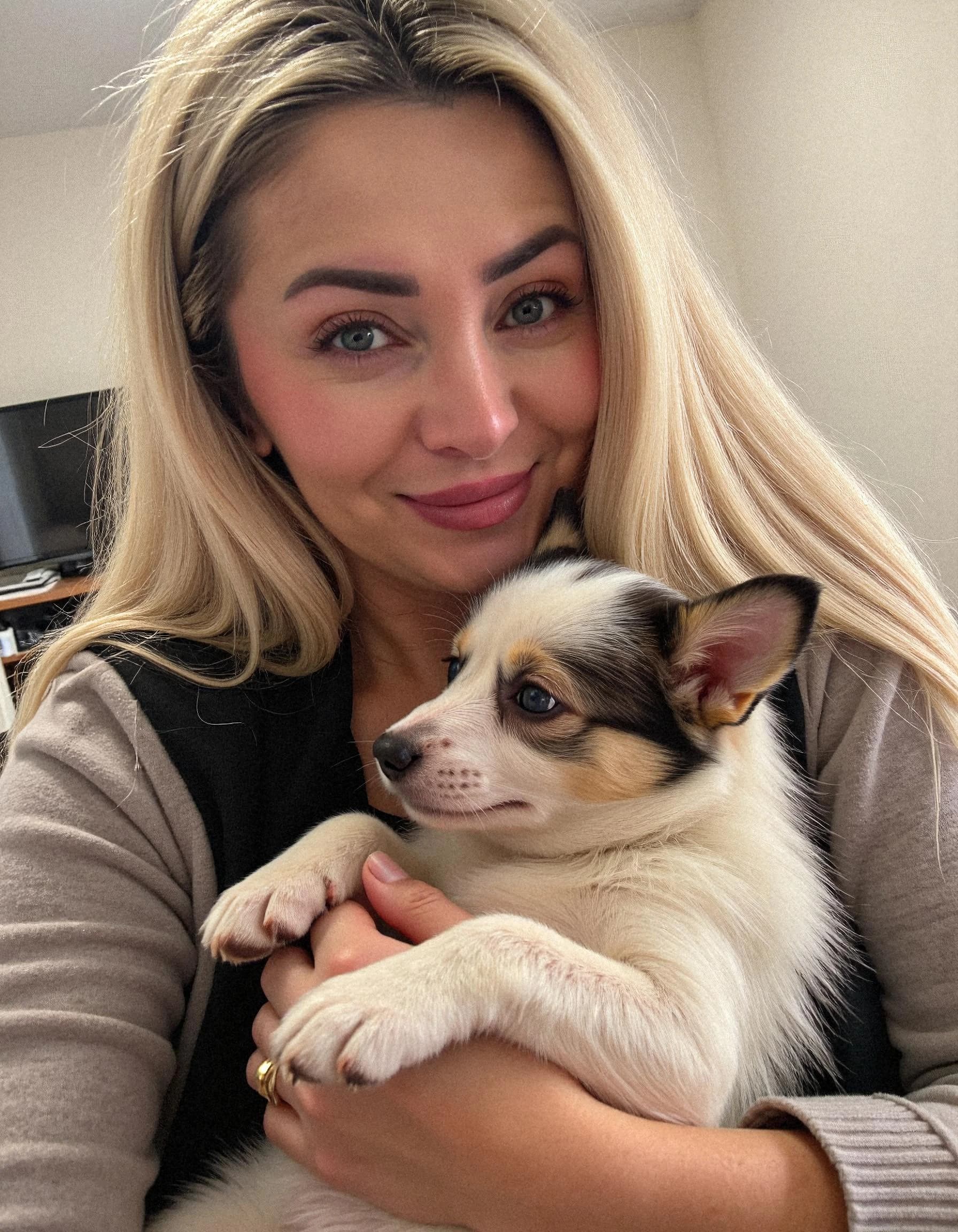 Professional headshot example: Woman Home Sweater Holding Dog — LinkedInHeadshots.ai