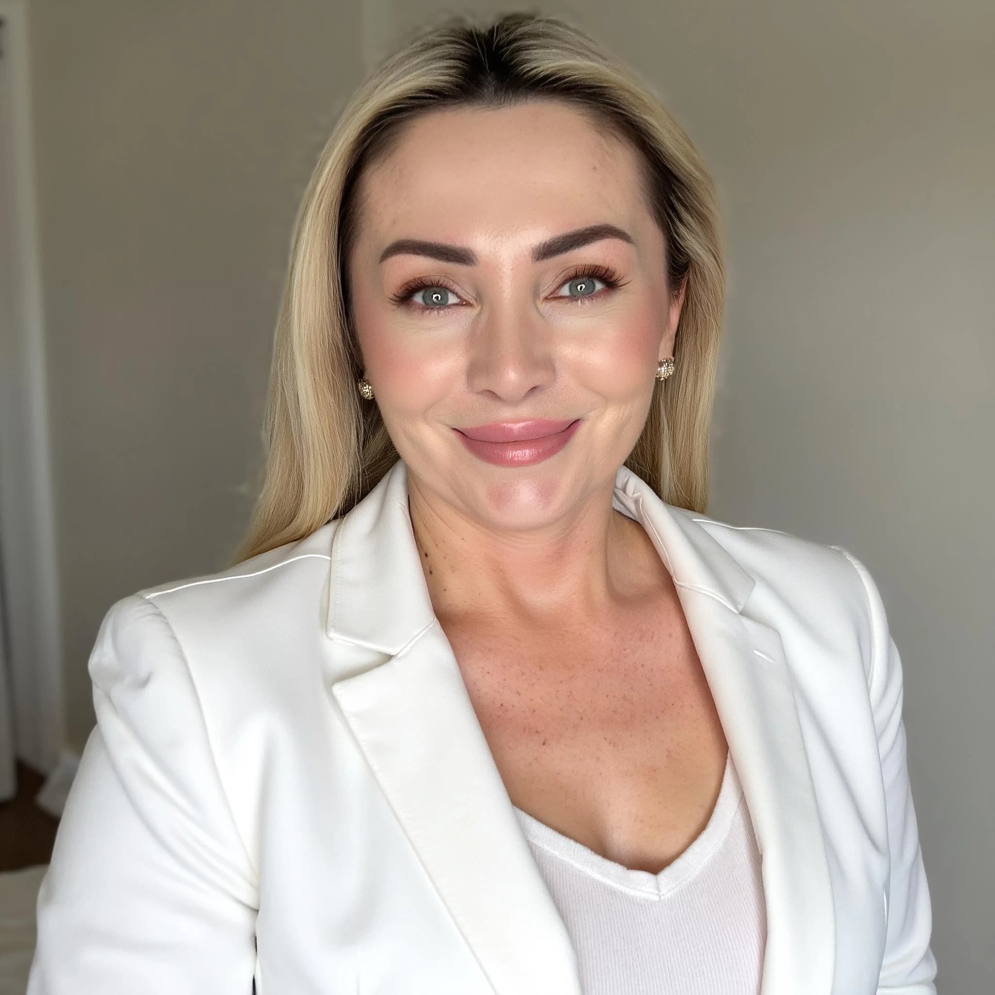 Professional headshot example: Woman Home White Blazer Smiling — LinkedInHeadshots.ai