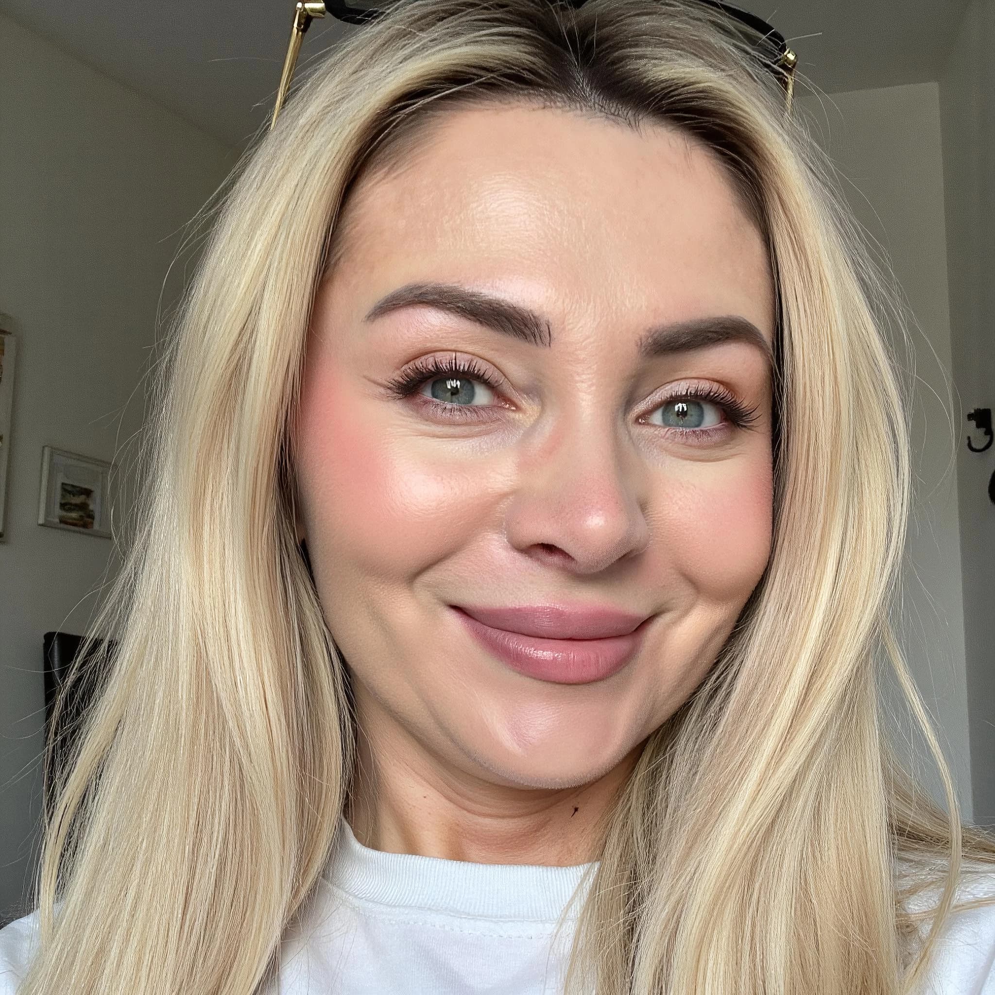 Professional headshot example: Woman Home White Shirt Smiling — LinkedInHeadshots.ai