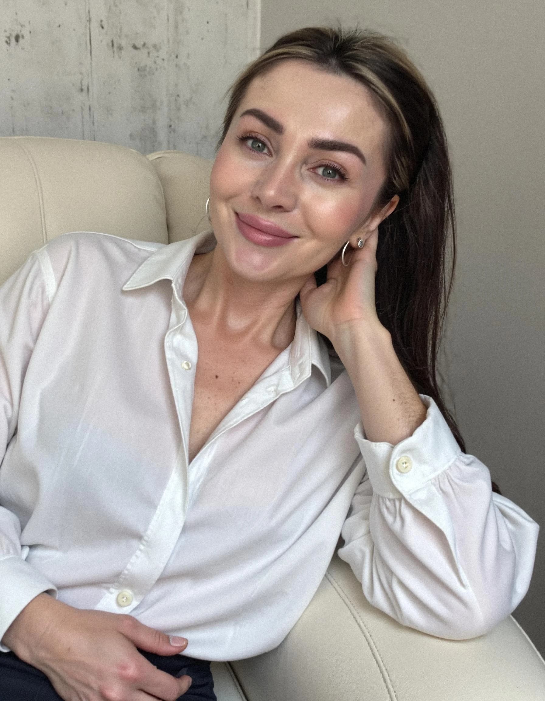 Professional headshot example: Woman Home White Shirt Smiling 2 — LinkedInHeadshots.ai