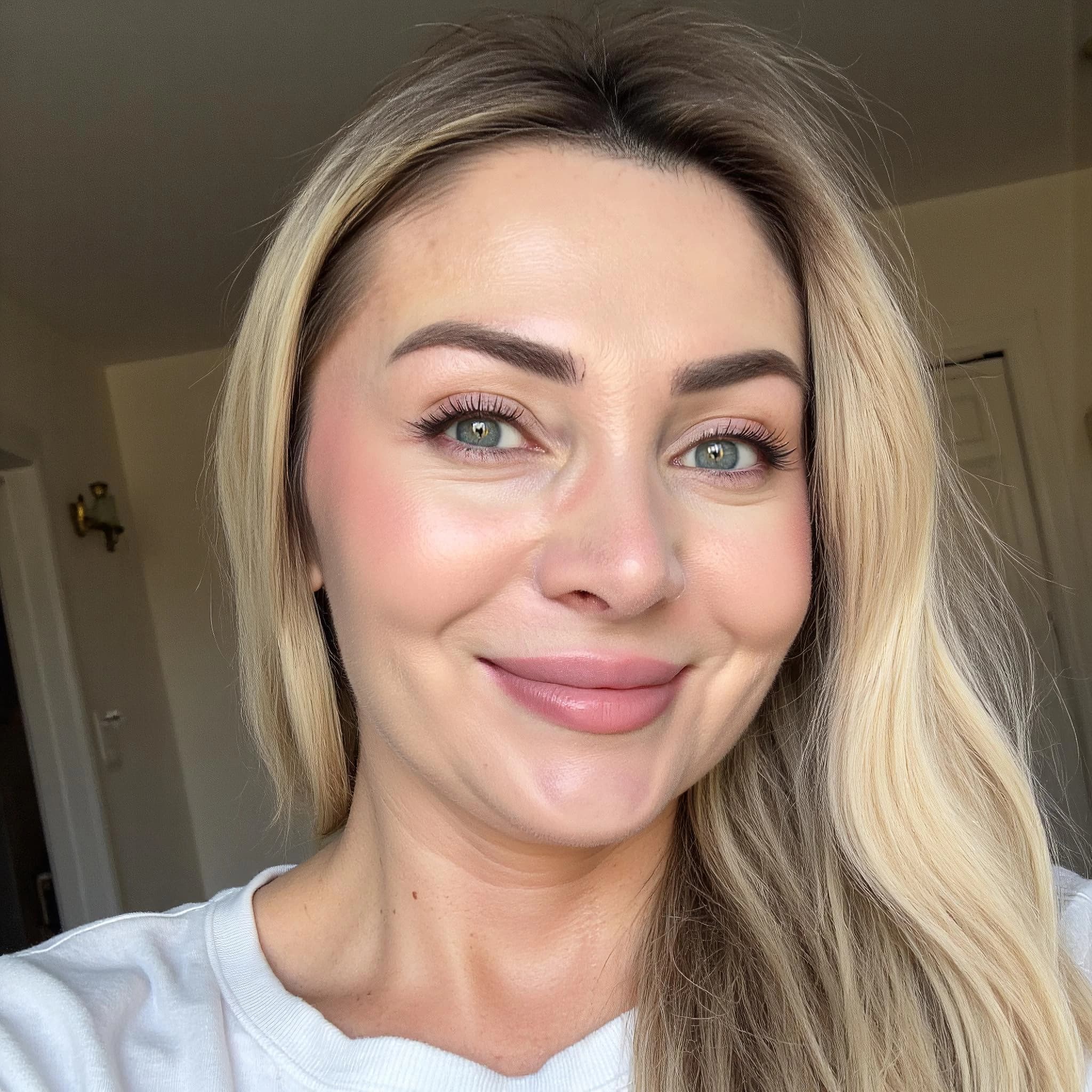 Professional headshot example: Woman Home White Top Smiling — LinkedInHeadshots.ai