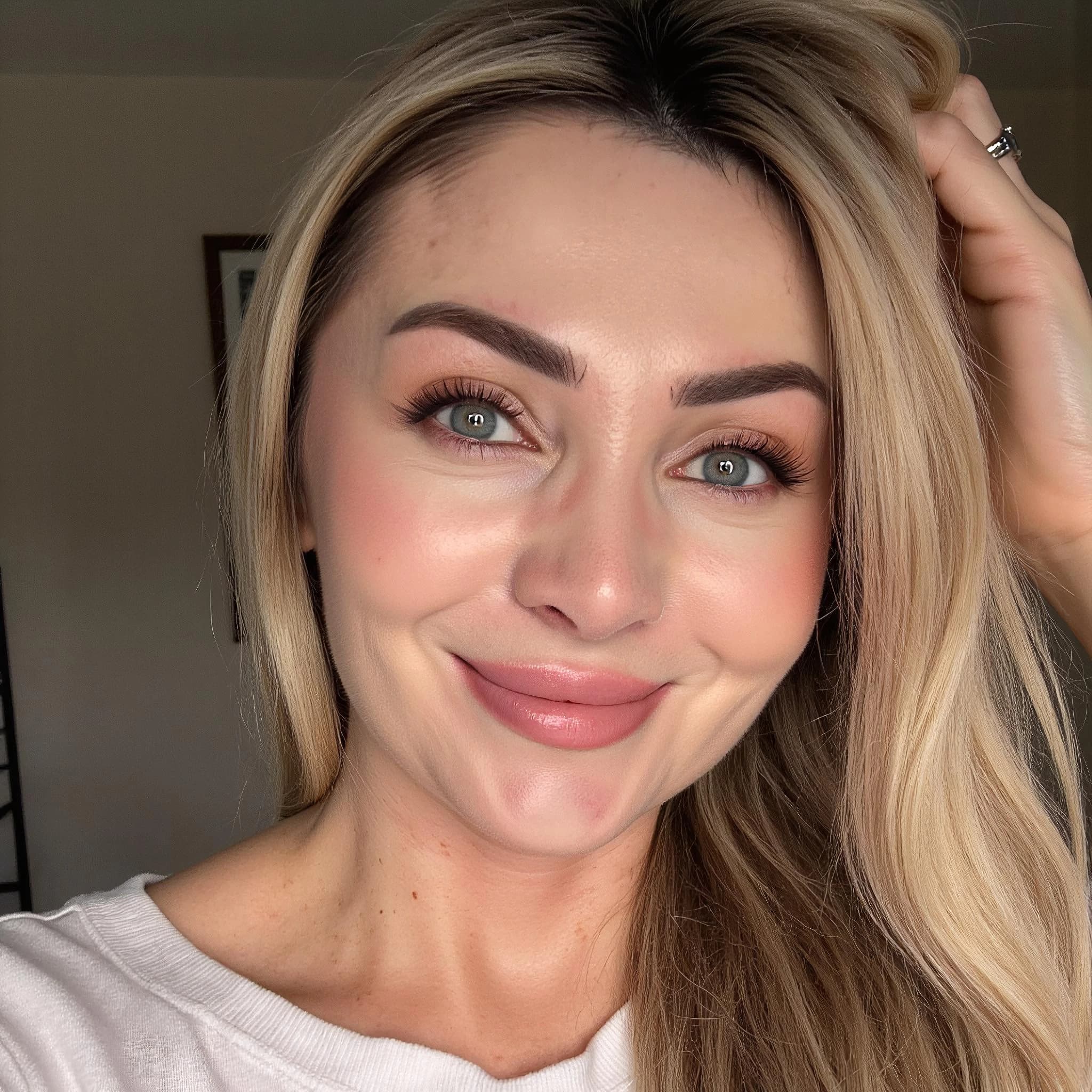 Professional headshot example: Woman Home White Top Smiling 9 — LinkedInHeadshots.ai