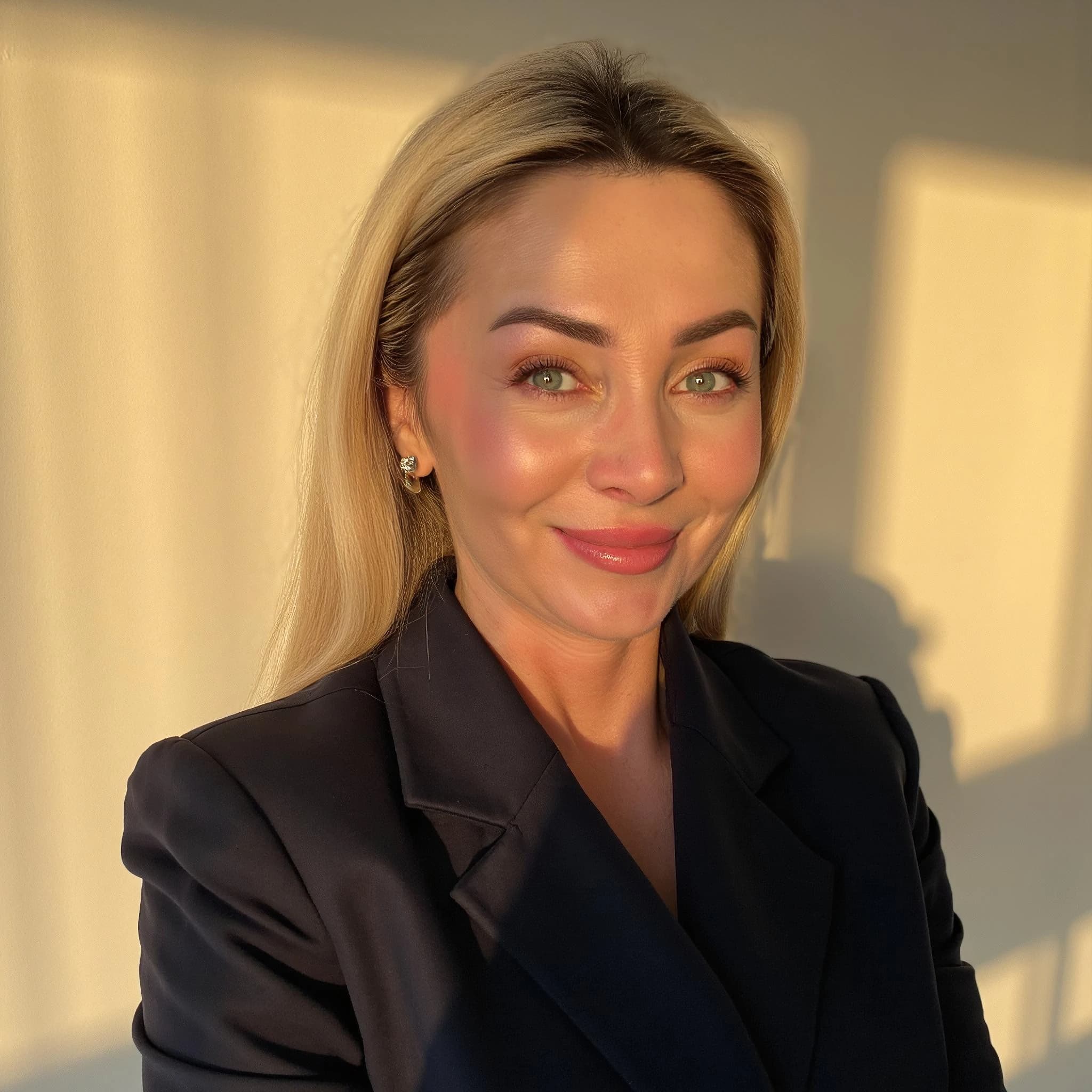 Professional headshot example: Woman Indoor Black Blazer Smiling — LinkedInHeadshots.ai