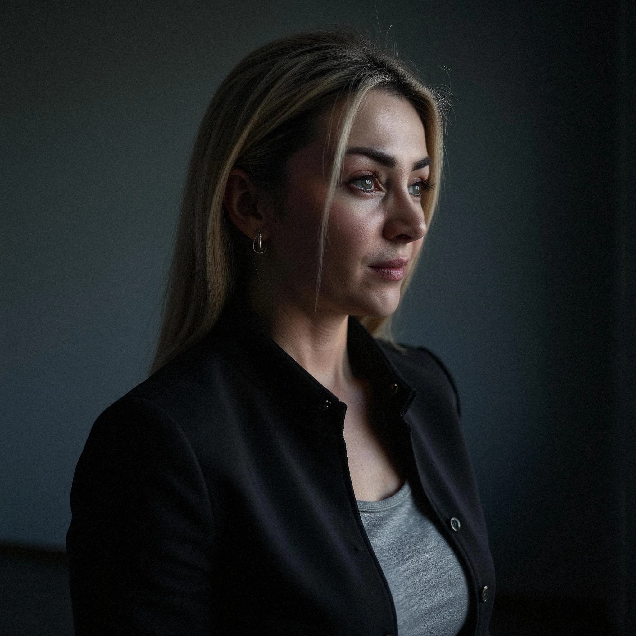 Professional headshot example: Woman Indoor Black Jacket Profile 2 — LinkedInHeadshots.ai