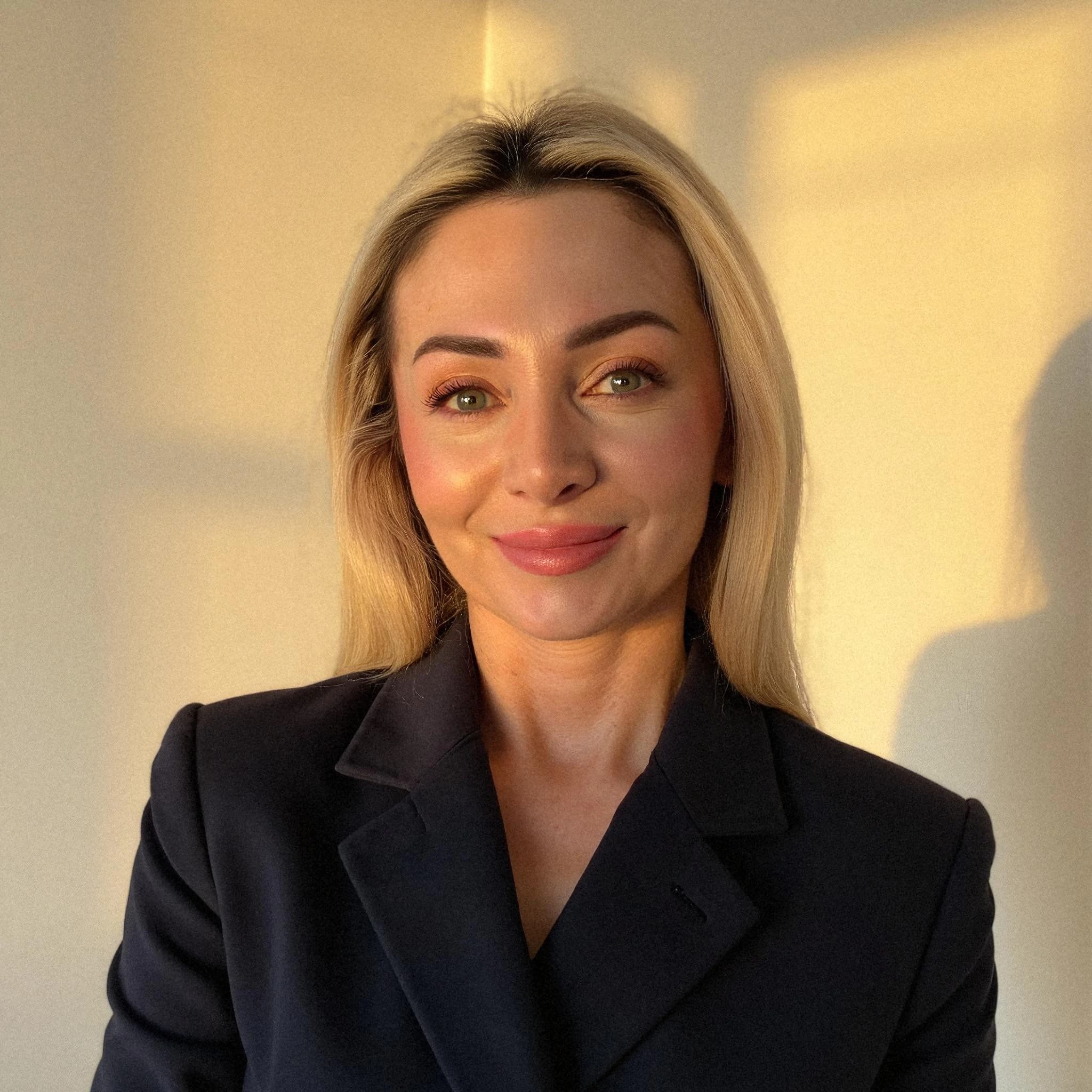 Professional headshot example: Woman Indoor Black Jacket Smiling — LinkedInHeadshots.ai