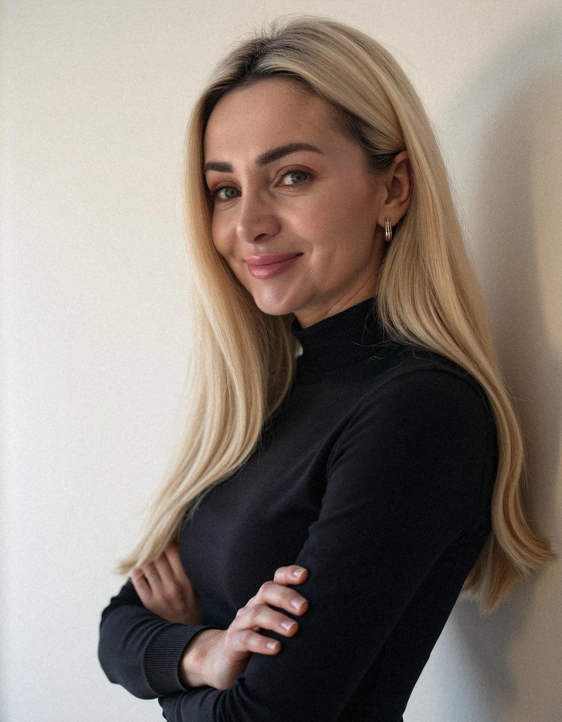 Professional headshot example: Woman Indoor Black Top Crossed Arms — LinkedInHeadshots.ai