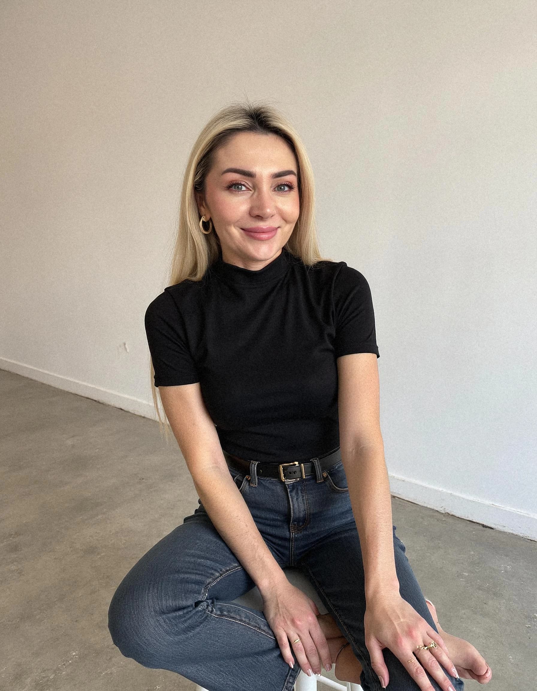 Professional headshot example: Woman Indoor Black Top Sitting — LinkedInHeadshots.ai