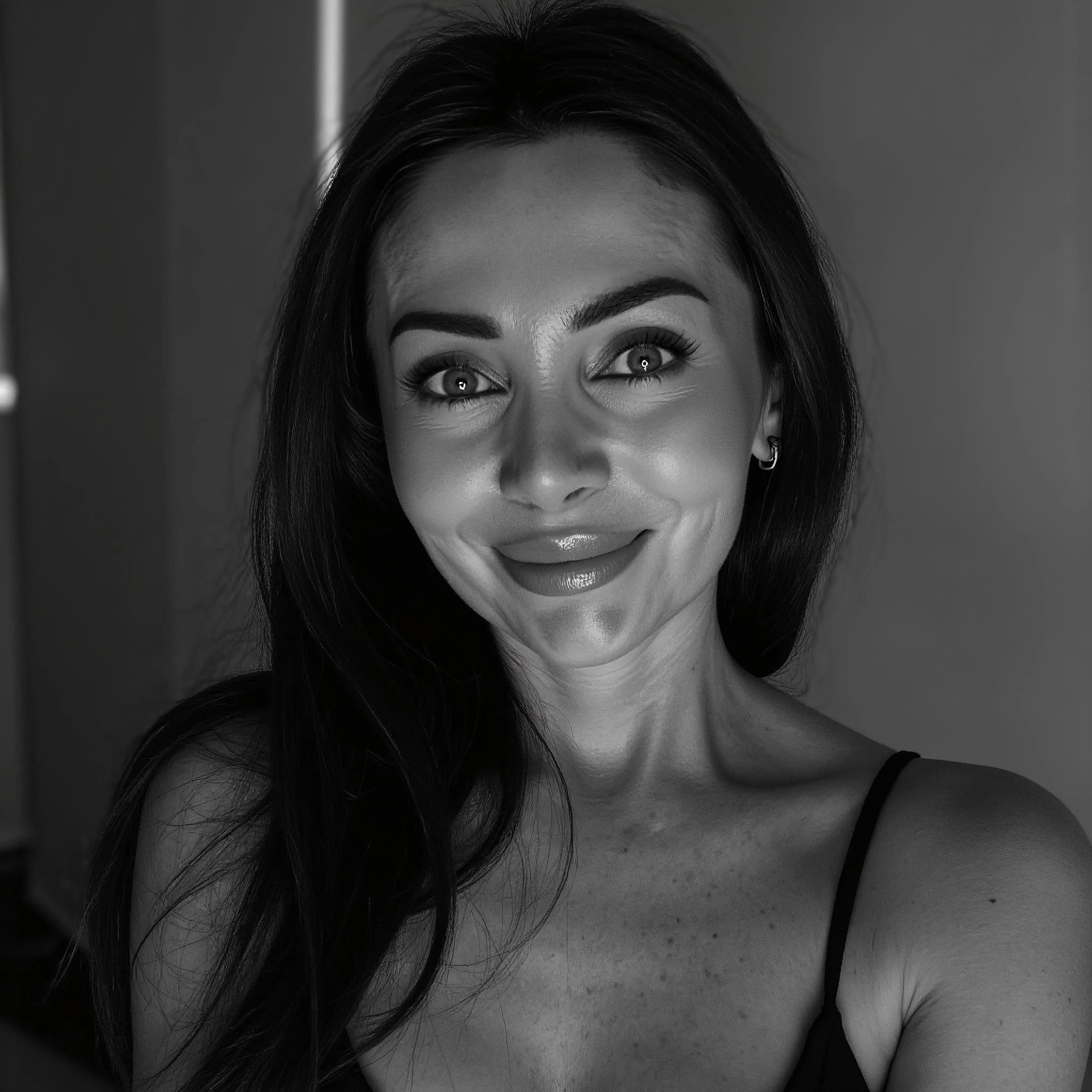 Professional headshot example: Woman Indoor Black Top Smiling 2 — LinkedInHeadshots.ai