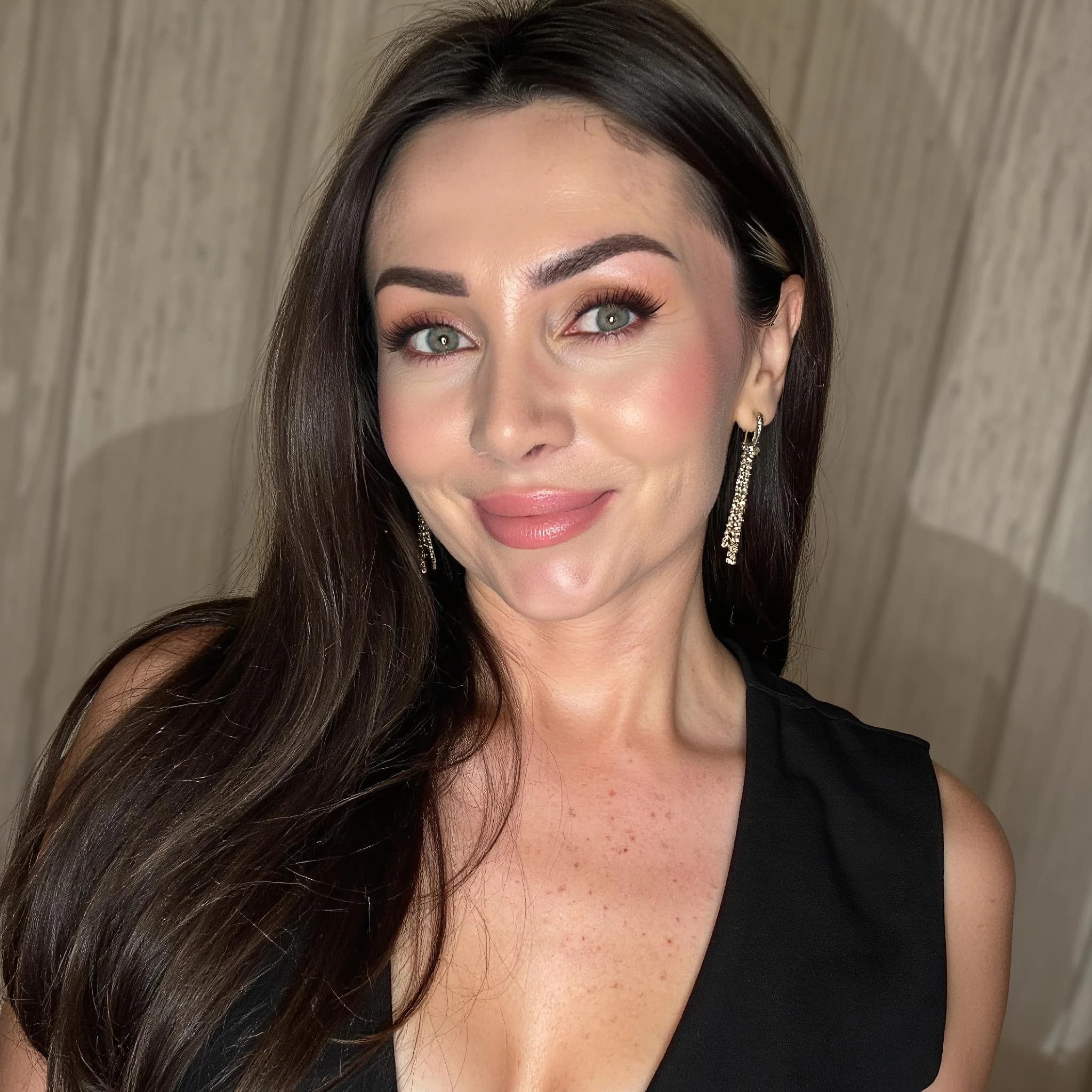 Professional headshot example: Woman Indoor Black Top Smiling 4 — LinkedInHeadshots.ai