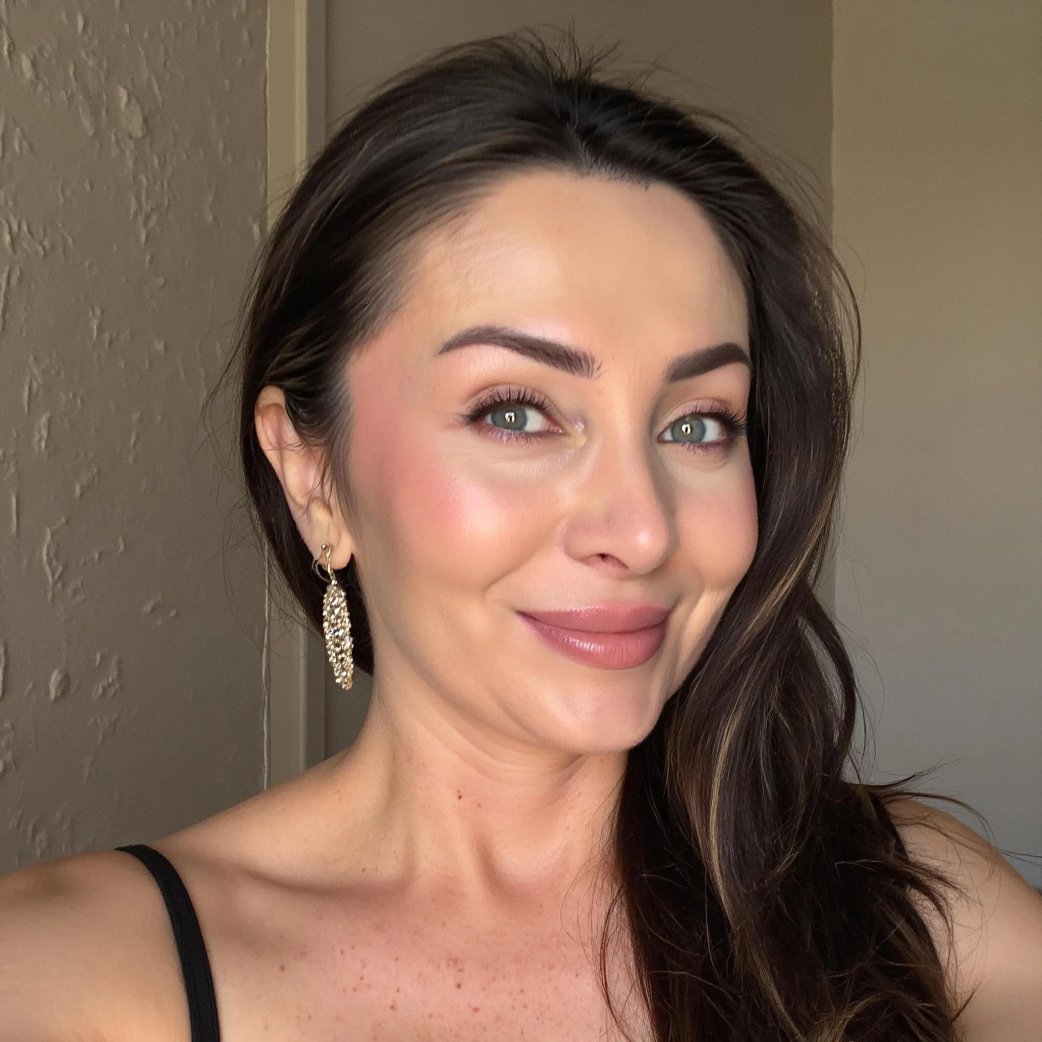 Professional headshot example: Woman Indoor Black Top Smiling Selfie — LinkedInHeadshots.ai