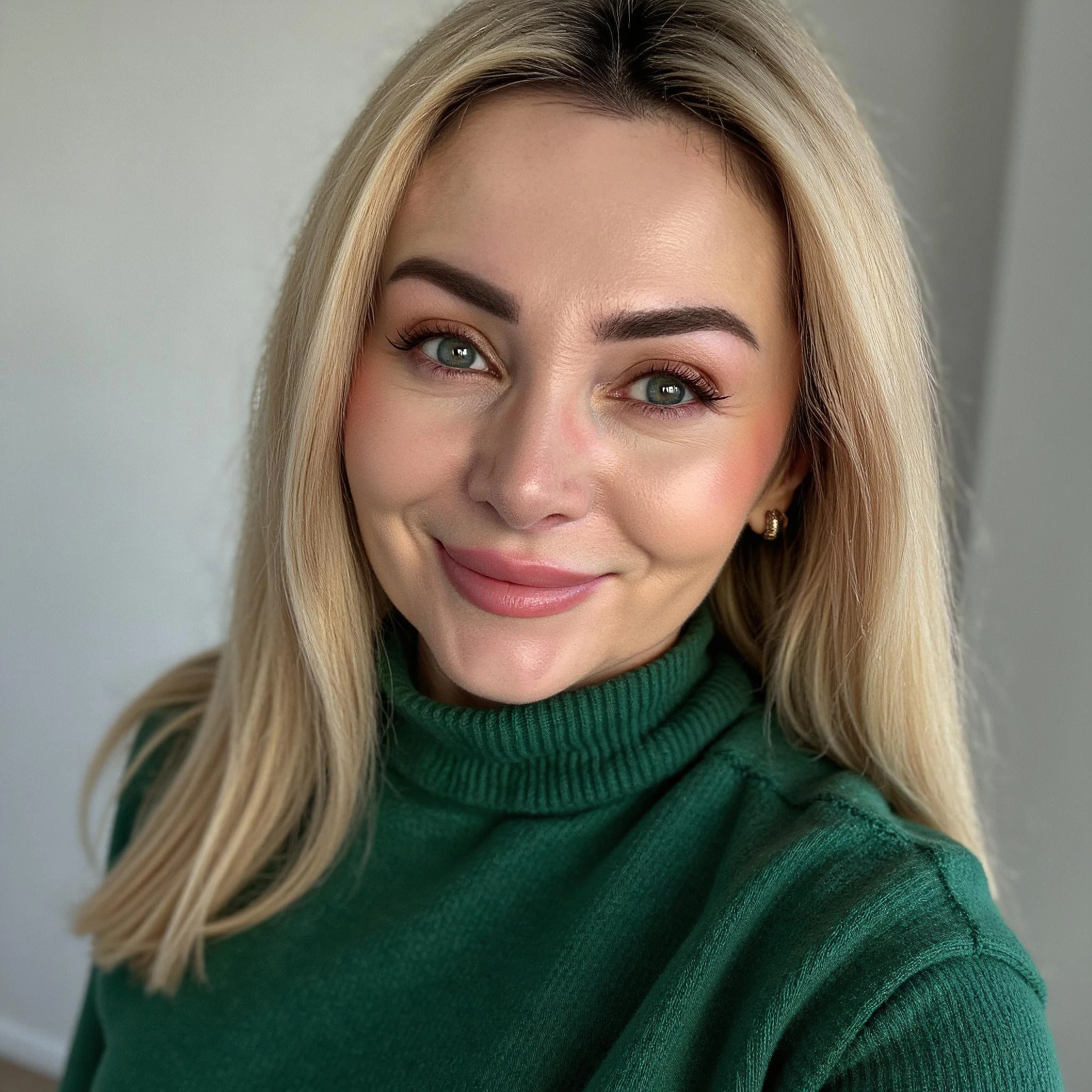 Professional headshot example: Woman Indoor Green Sweater Smiling — LinkedInHeadshots.ai