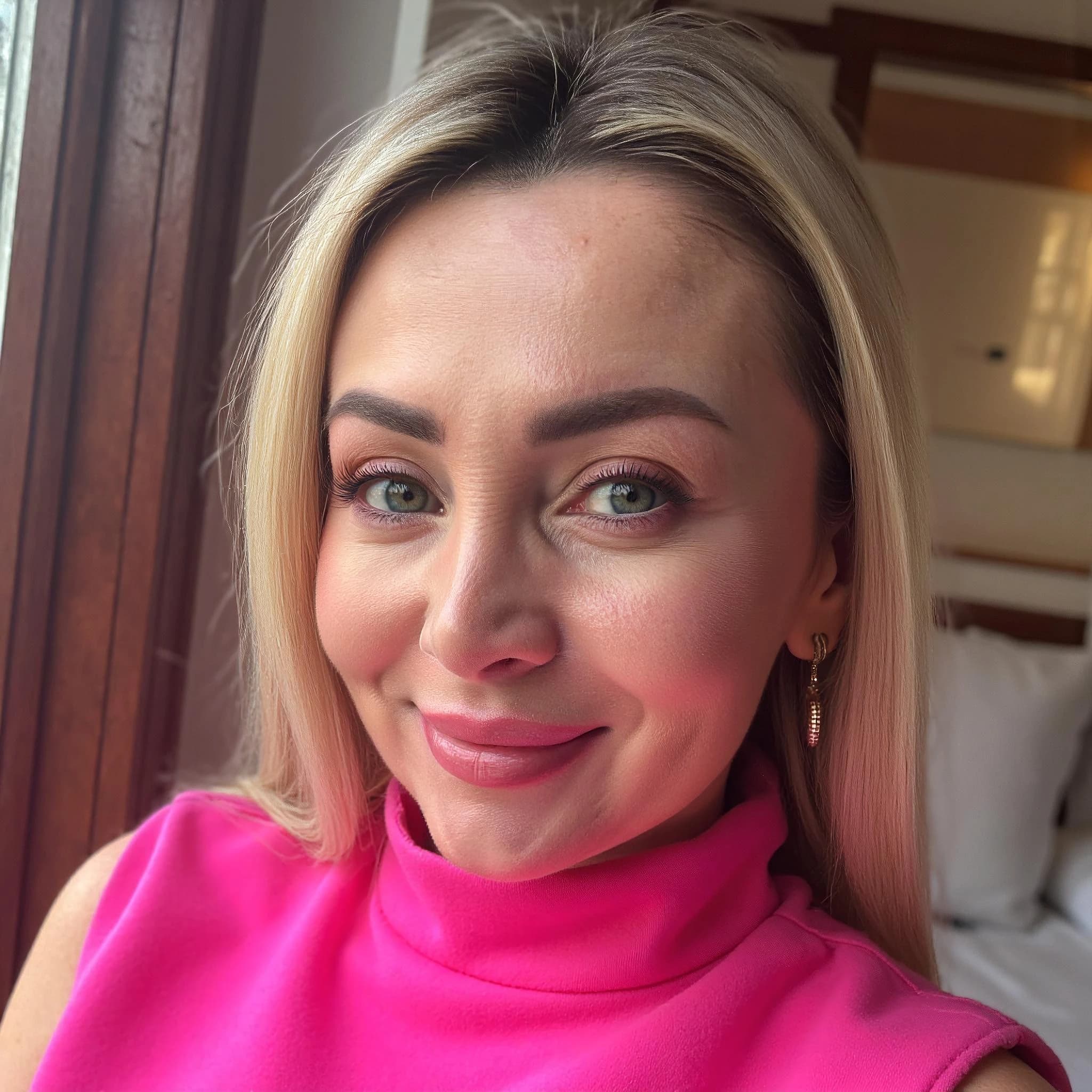 Professional headshot example: Woman Indoor Pink Top Smiling 3 — LinkedInHeadshots.ai