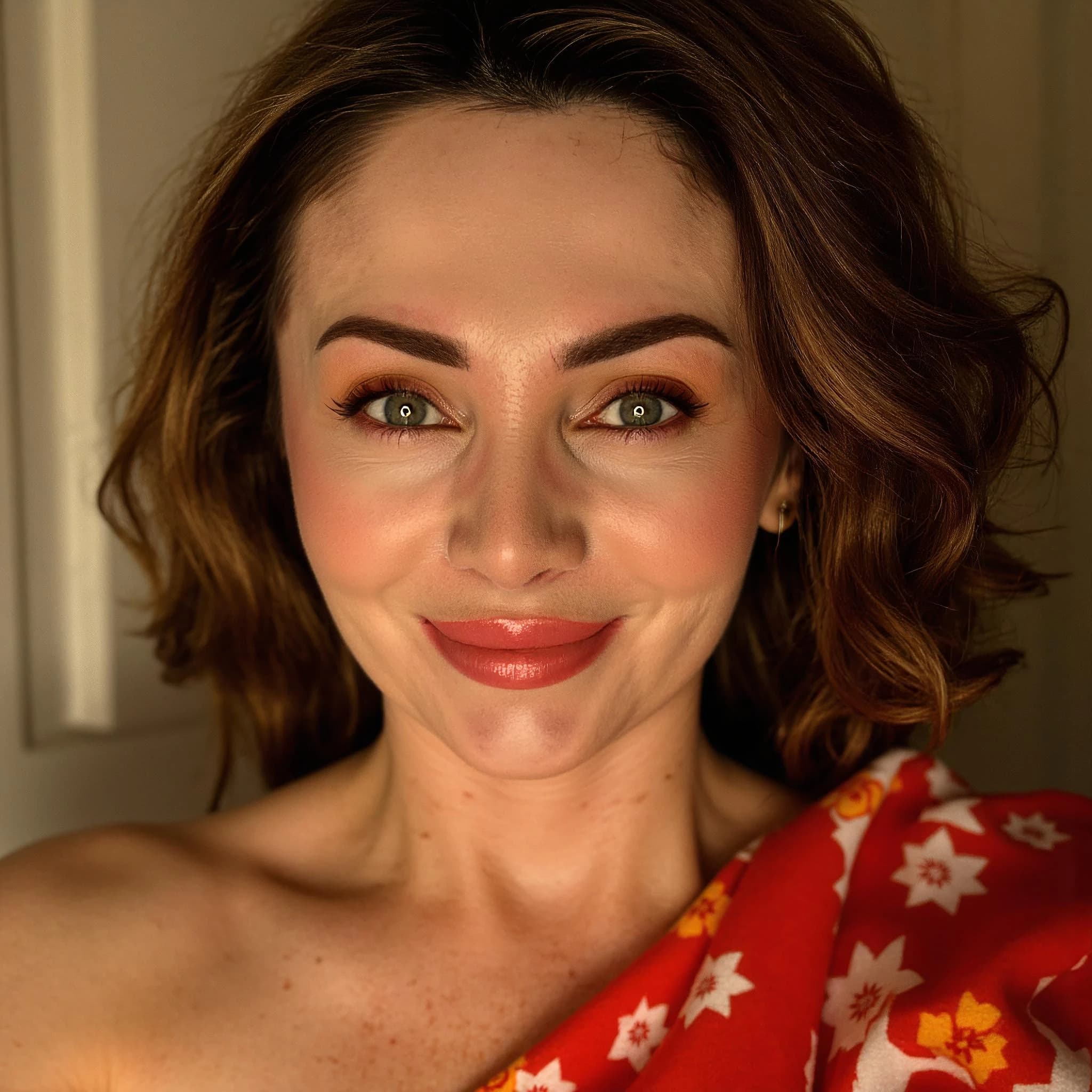 Professional headshot example: Woman Indoor Red Floral Top Smiling — LinkedInHeadshots.ai