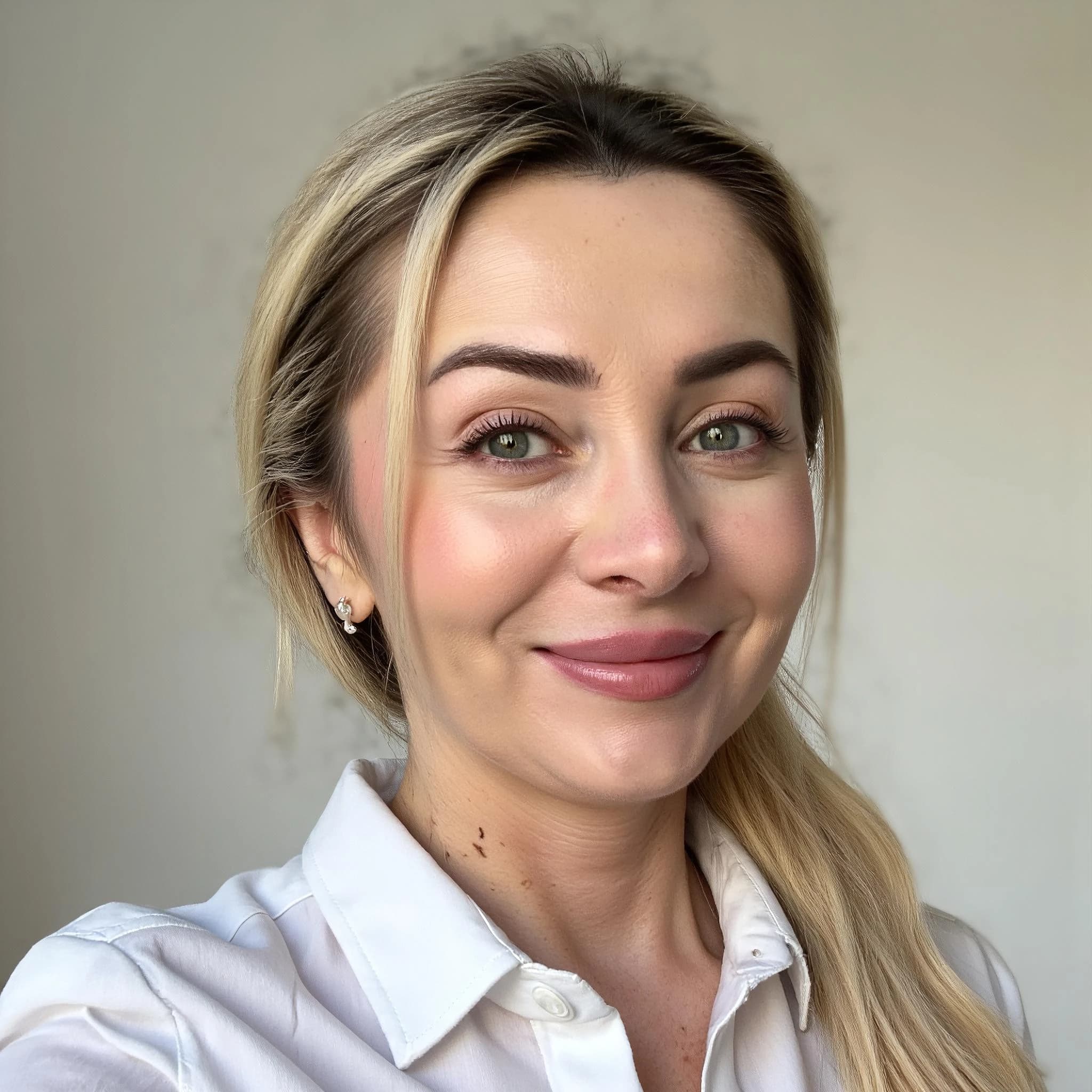 Professional headshot example: Woman Indoor White Shirt Smiling — LinkedInHeadshots.ai