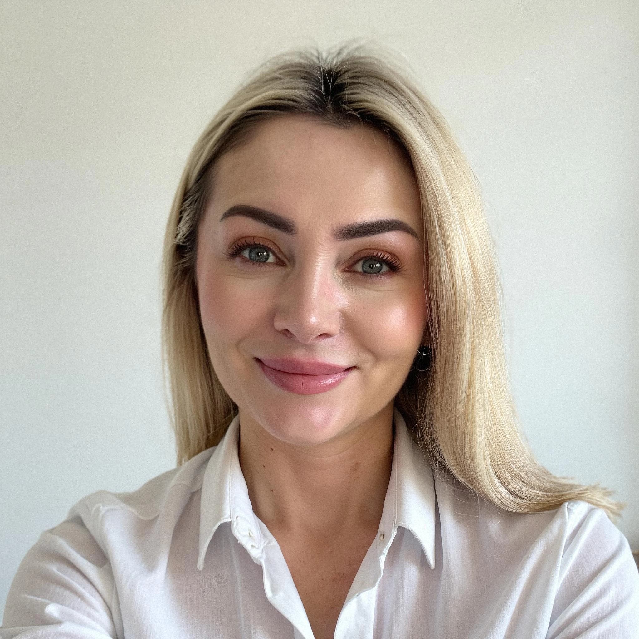 Professional headshot example: Woman Indoor White Shirt Smiling 2 — LinkedInHeadshots.ai