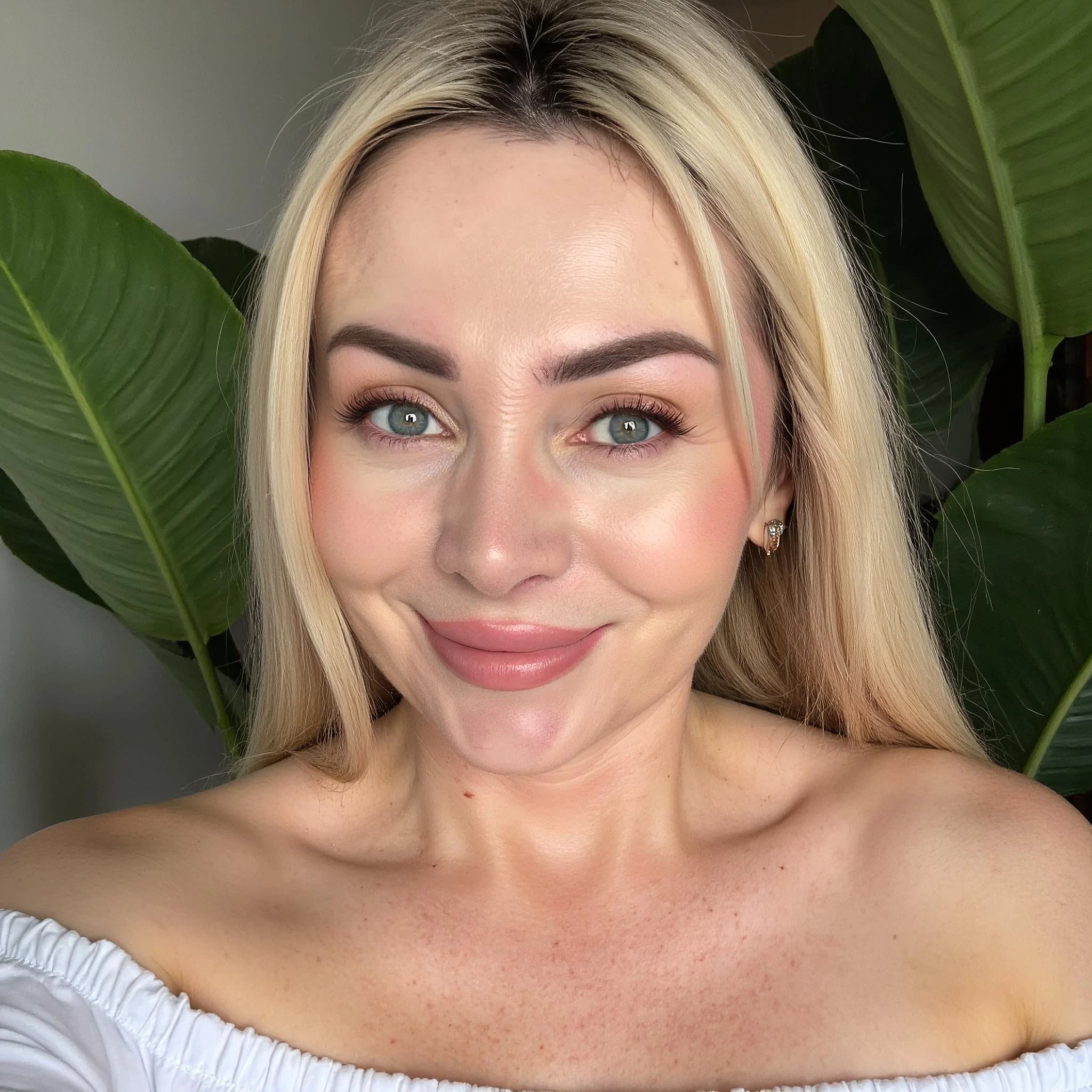 Professional headshot example: Woman Indoor White Top Smiling 11 — LinkedInHeadshots.ai