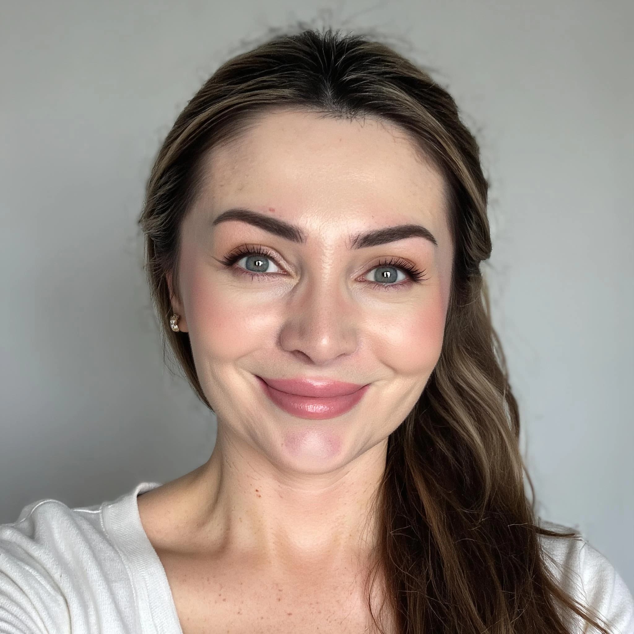 Professional headshot example: Woman Indoor White Top Smiling 4 — LinkedInHeadshots.ai