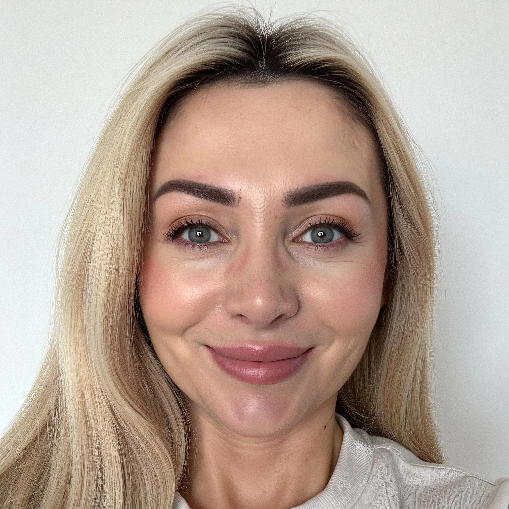 Professional headshot example: Woman Indoor White Top Smiling 5 — LinkedInHeadshots.ai