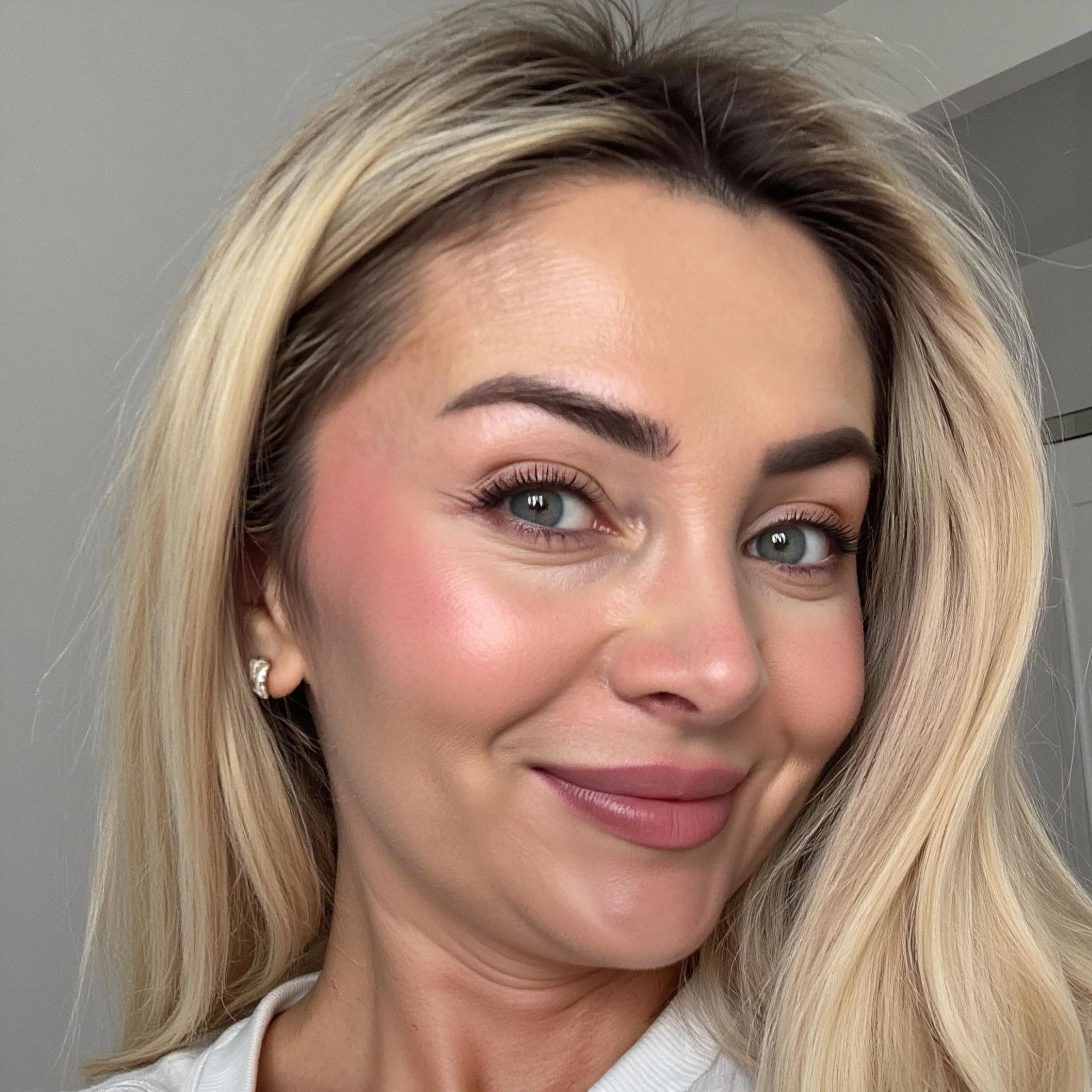 Professional headshot example: Woman Indoor White Top Smiling 6 — LinkedInHeadshots.ai