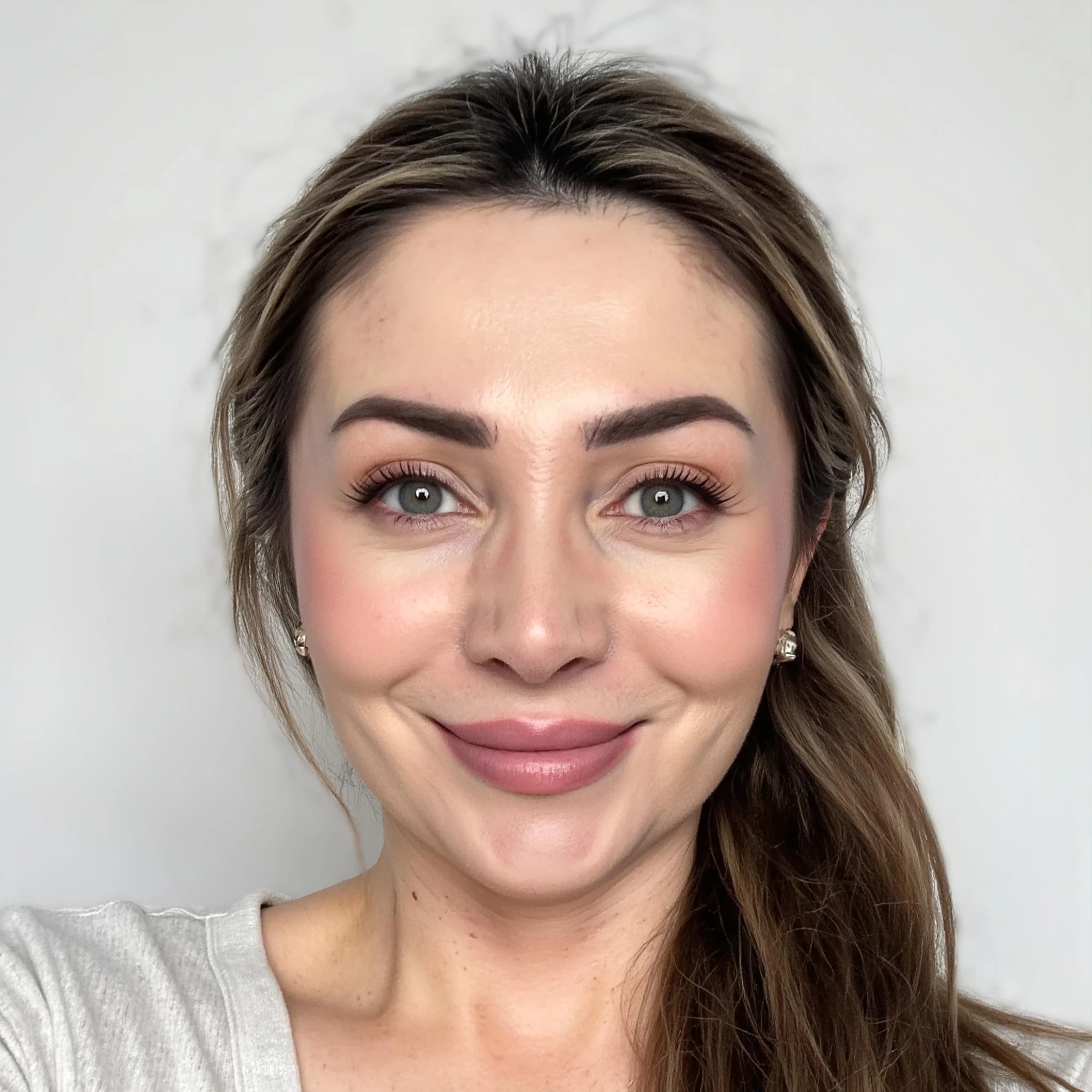 Professional headshot example: Woman Indoor White Top Smiling Headshot 2 — LinkedInHeadshots.ai