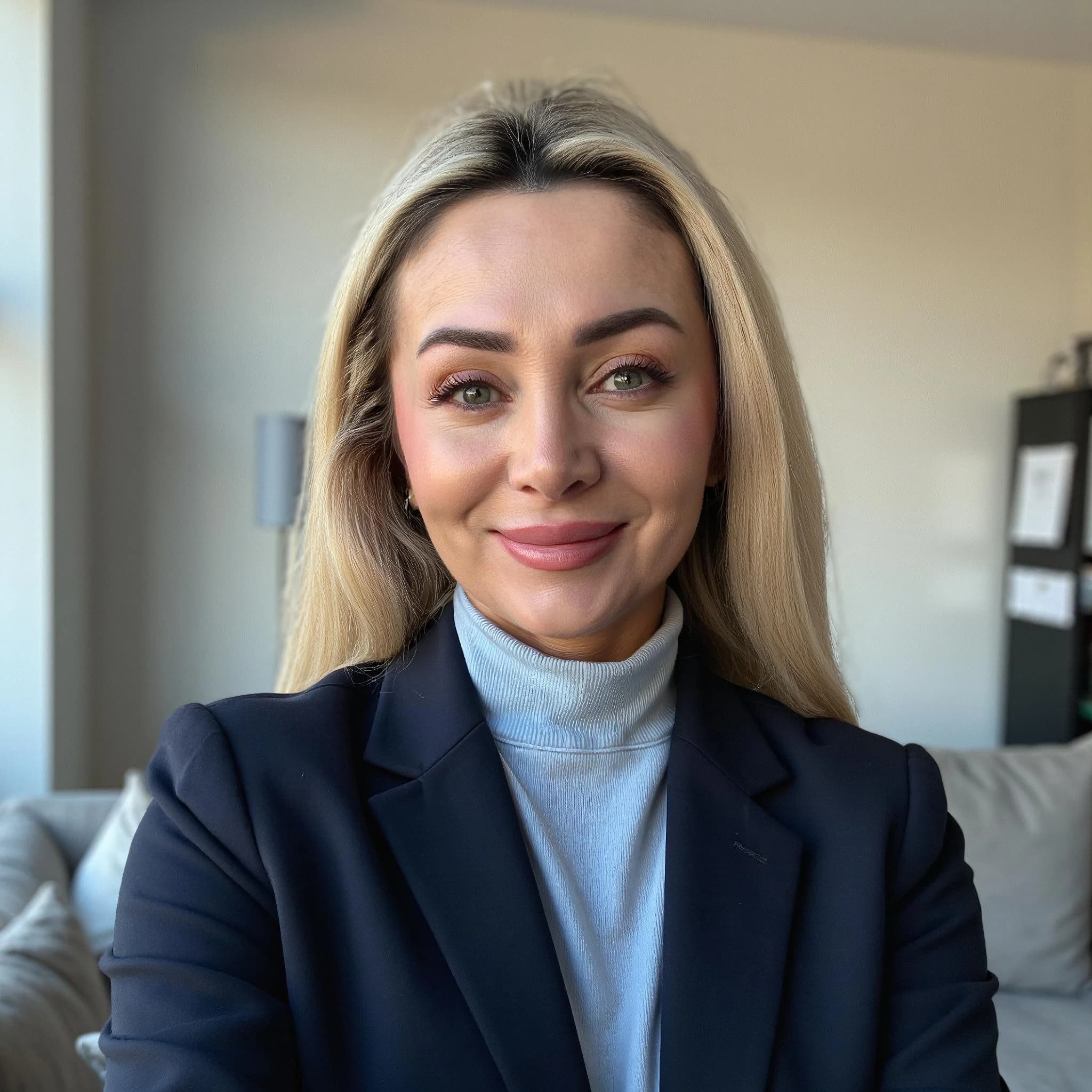 Professional headshot example: Woman Livingroom Blazer Smiling Headshot — LinkedInHeadshots.ai