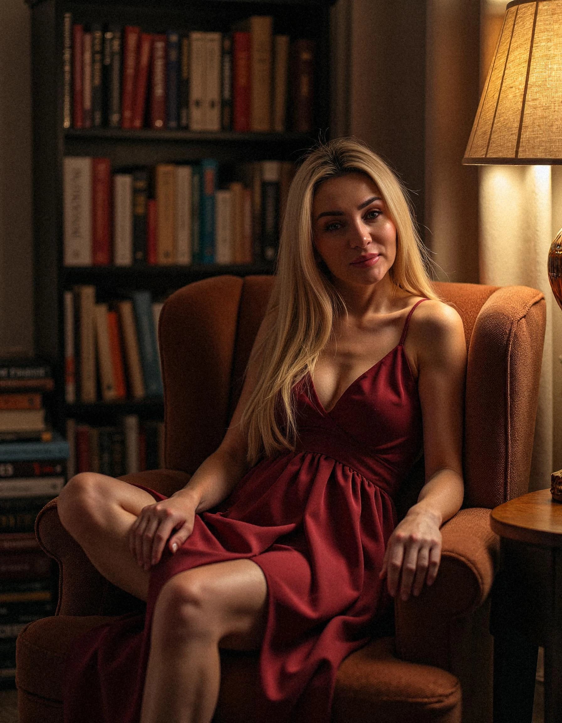Professional headshot example: Woman Livingroom Red Dress Sitting — LinkedInHeadshots.ai